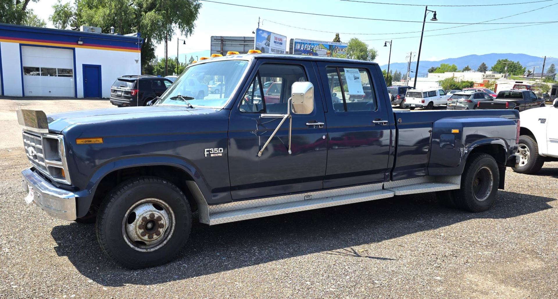 1986 Blue /Blue Ford F-350 Base (2FTJW35LXGC) with an 7.5L V8 OHV 16V engine, Automatic transmission, located at 450 N Russell, Missoula, MT, 59801, (406) 543-6600, 46.874496, -114.017433 - 1 Ton Dually Long Box CrewCab. Rear Wheel Drive. 7.5 Liter V8. Automatic Transmission. 43,284 Original Miles. Interior is close to Perfect. Even the headliner is immaculate. Clear Coat is pealing some. Left Rear Fender has some damage. This vehicle is more then 20 years old and is not eligible f - Photo#1