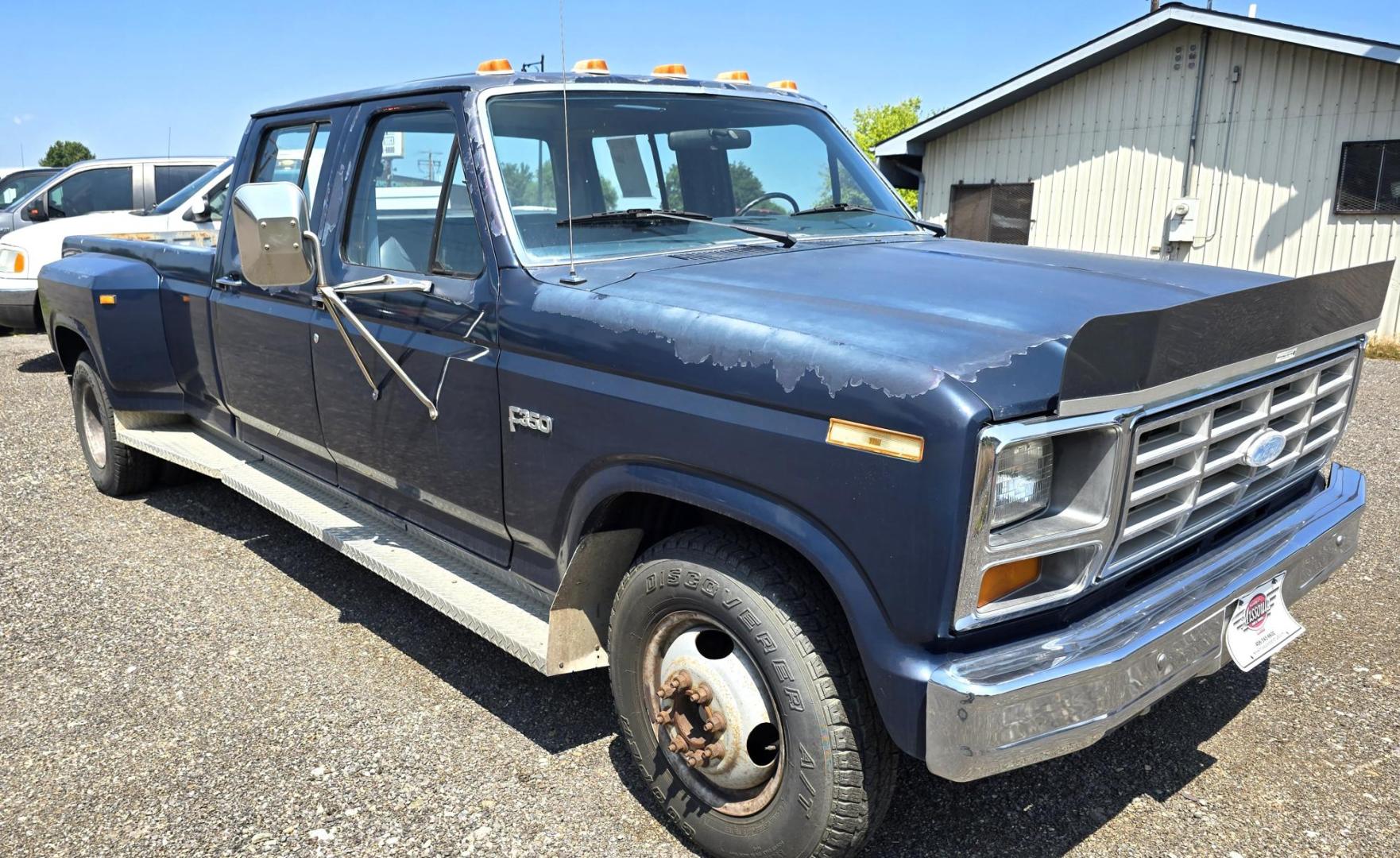 1986 Blue /Blue Ford F-350 Base (2FTJW35LXGC) with an 7.5L V8 OHV 16V engine, Automatic transmission, located at 450 N Russell, Missoula, MT, 59801, (406) 543-6600, 46.874496, -114.017433 - 1 Ton Dually Long Box CrewCab. Rear Wheel Drive. 7.5 Liter V8. Automatic Transmission. 43,284 Original Miles. Interior is close to Perfect. Even the headliner is immaculate. Clear Coat is pealing some. Left Rear Fender has some damage. This vehicle is more then 20 years old and is not eligible f - Photo#4
