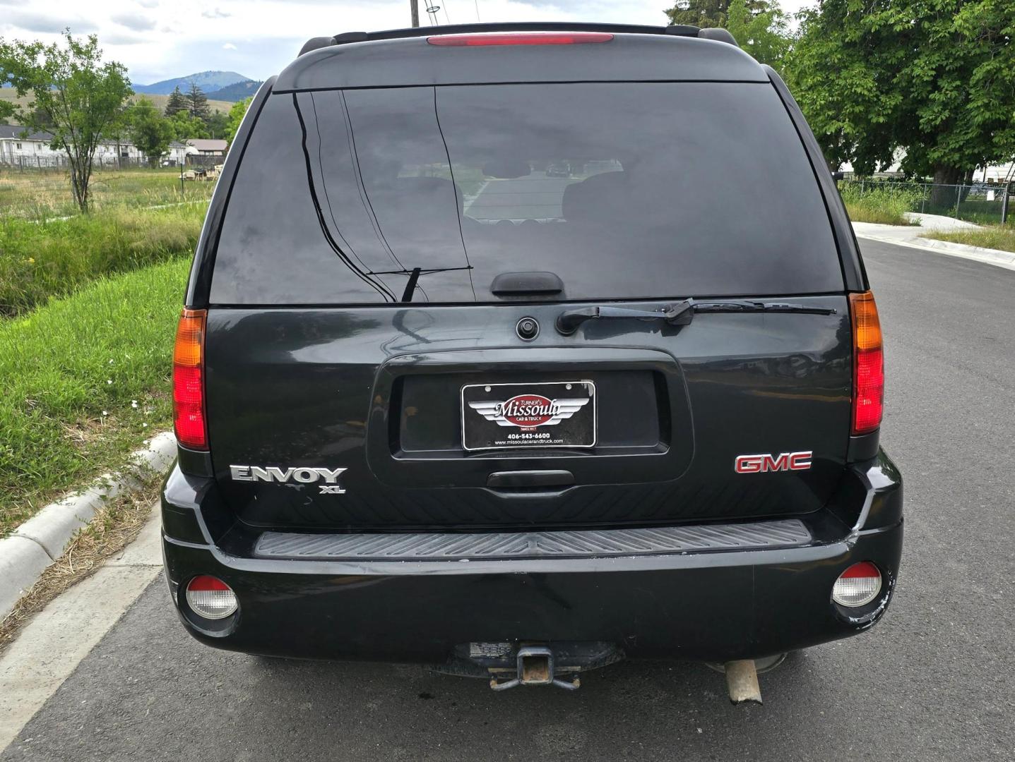 2004 Black /Gray GMC Envoy XL SLE 2WD (1GKES16S446) with an 4.2L L6 DOHC 24V engine, 4-Speed Automatic Overdrive transmission, located at 450 N Russell, Missoula, MT, 59801, (406) 543-6600, 46.874496, -114.017433 - Very Straight 2WD SUV. 4.2L V6 Engine. Automatic Transmission. 3rd Row Seating. Front and Rear Climate Control. Air. Cruise. Tilt. Power Windows and Locks. Power Drivers Seat. Towing. AM FM CD Player. Because of the age, our Lenders do NOT offer financing on this vehicle. - Photo#6