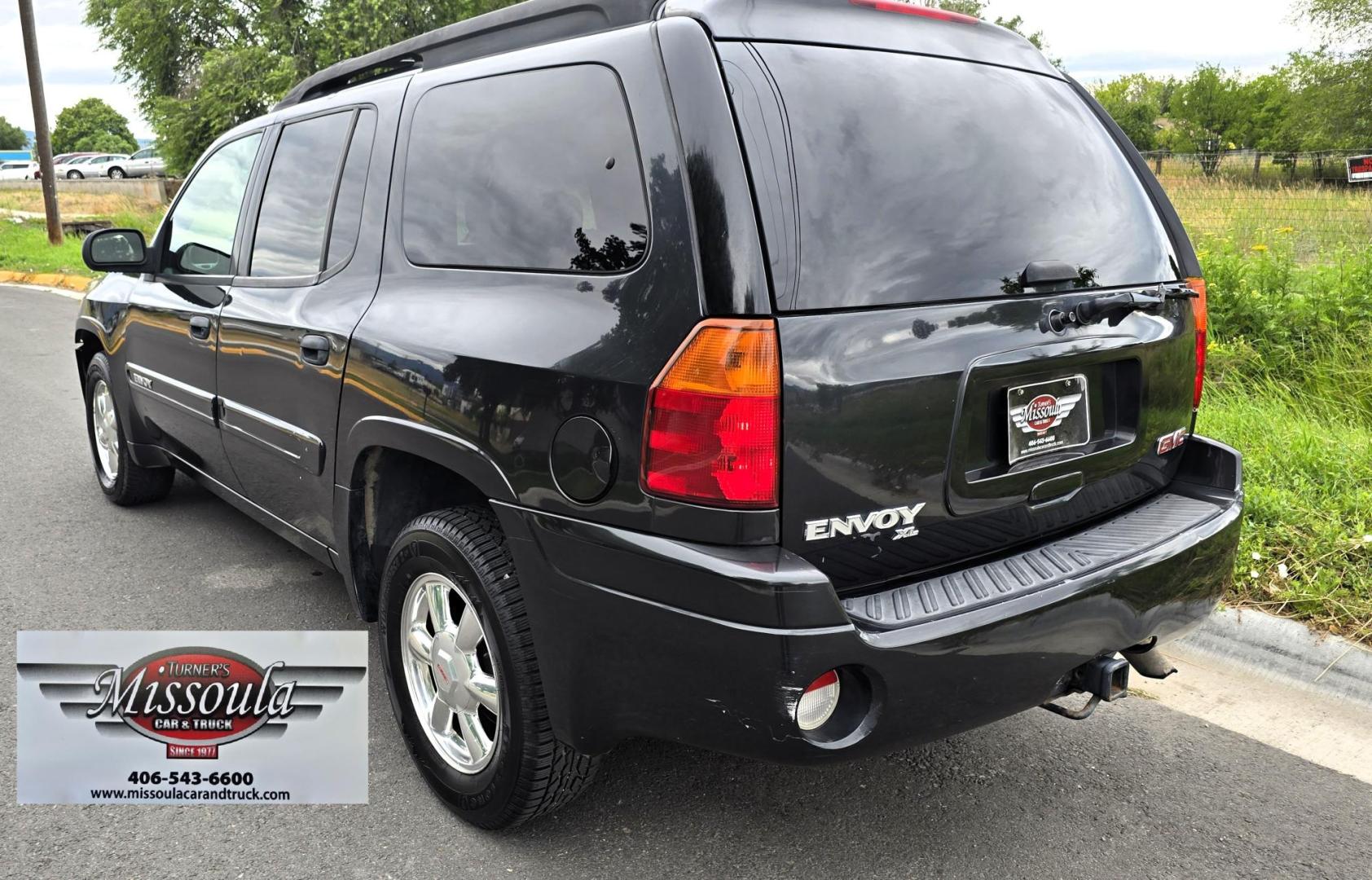 2004 Black /Gray GMC Envoy XL SLE 2WD (1GKES16S446) with an 4.2L L6 DOHC 24V engine, 4-Speed Automatic Overdrive transmission, located at 450 N Russell, Missoula, MT, 59801, (406) 543-6600, 46.874496, -114.017433 - Very Straight 2WD SUV. 4.2L V6 Engine. Automatic Transmission. 3rd Row Seating. Front and Rear Climate Control. Air. Cruise. Tilt. Power Windows and Locks. Power Drivers Seat. Towing. AM FM CD Player. Because of the age, our Lenders do NOT offer financing on this vehicle. - Photo#5