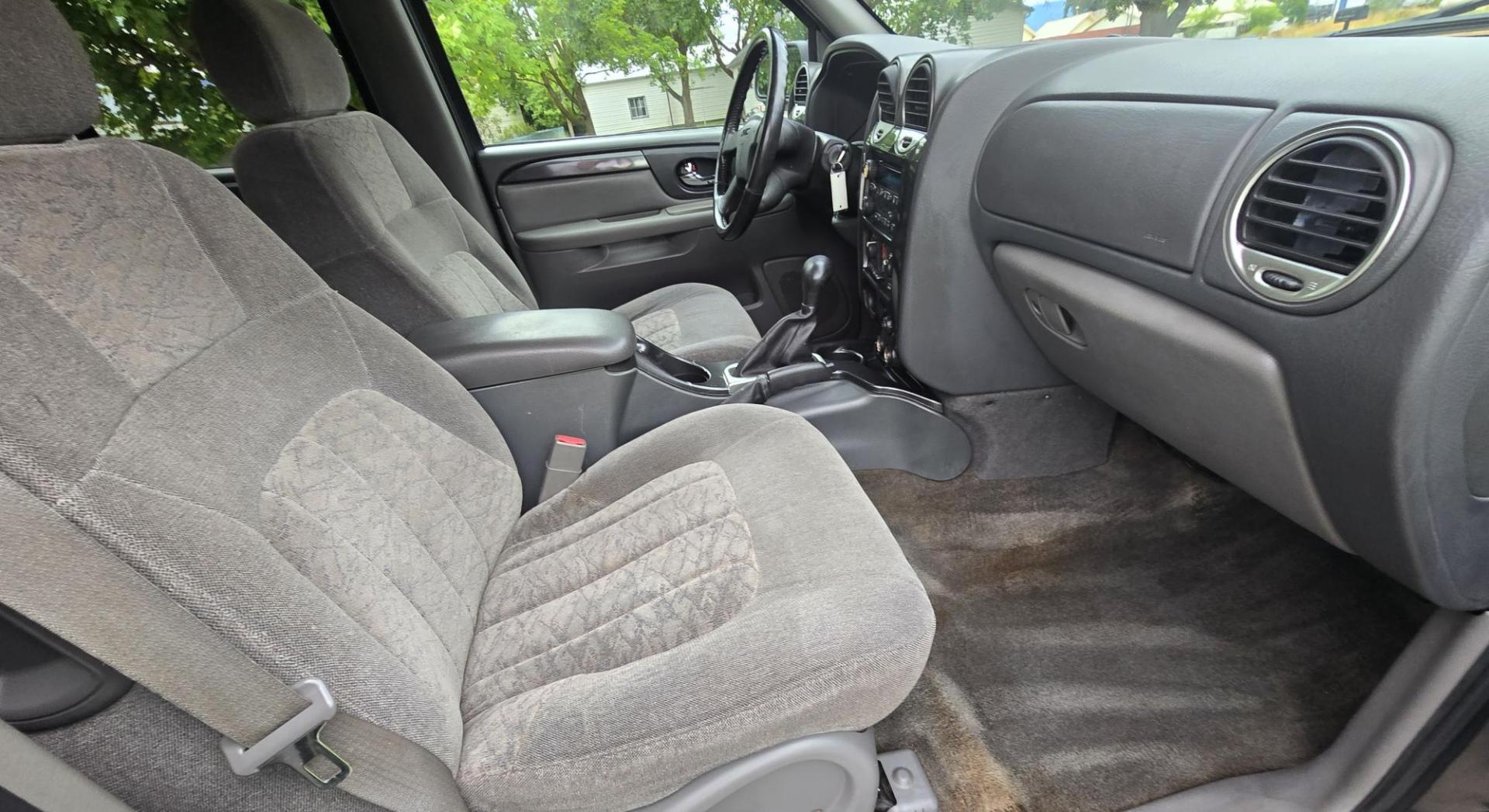 2004 Black /Gray GMC Envoy XL SLE 2WD (1GKES16S446) with an 4.2L L6 DOHC 24V engine, 4-Speed Automatic Overdrive transmission, located at 450 N Russell, Missoula, MT, 59801, (406) 543-6600, 46.874496, -114.017433 - Very Straight 2WD SUV. 4.2L V6 Engine. Automatic Transmission. 3rd Row Seating. Front and Rear Climate Control. Air. Cruise. Tilt. Power Windows and Locks. Power Drivers Seat. Towing. AM FM CD Player. Because of the age, our Lenders do NOT offer financing on this vehicle. - Photo#10