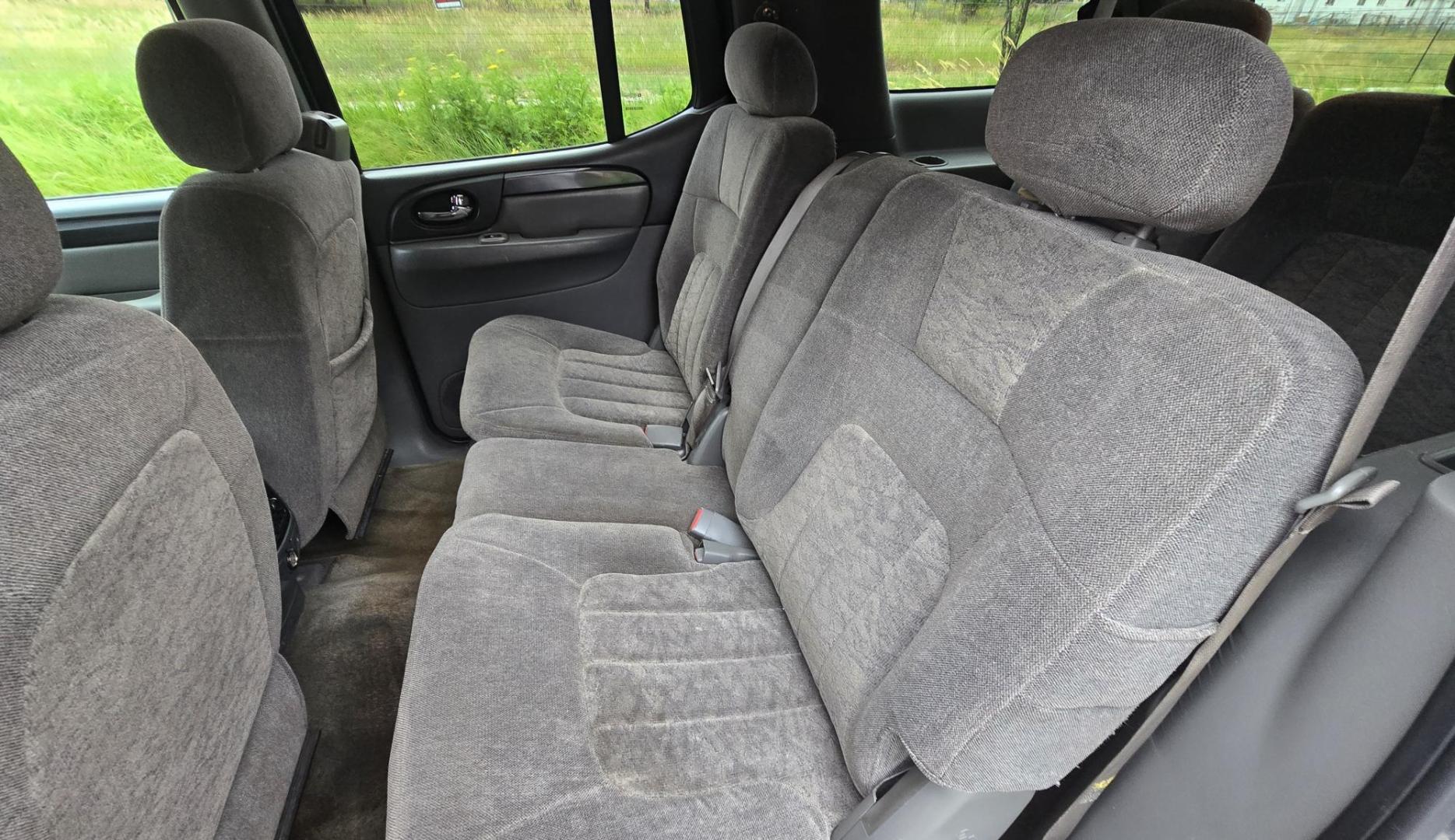 2004 Black /Gray GMC Envoy XL SLE 2WD (1GKES16S446) with an 4.2L L6 DOHC 24V engine, 4-Speed Automatic Overdrive transmission, located at 450 N Russell, Missoula, MT, 59801, (406) 543-6600, 46.874496, -114.017433 - Very Straight 2WD SUV. 4.2L V6 Engine. Automatic Transmission. 3rd Row Seating. Front and Rear Climate Control. Air. Cruise. Tilt. Power Windows and Locks. Power Drivers Seat. Towing. AM FM CD Player. Because of the age, our Lenders do NOT offer financing on this vehicle. - Photo#11
