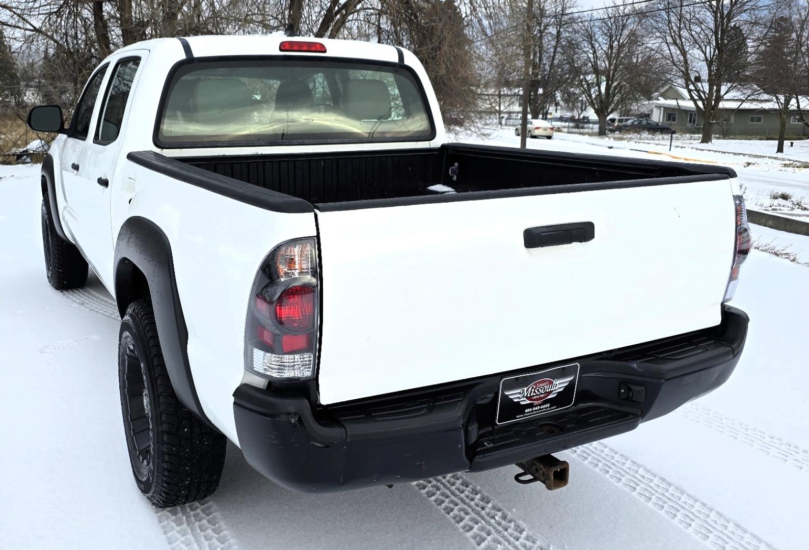 2012 White /Black Toyota Tacoma Double Cab V6 4WD (3TMLU4EN4CM) with an 4.0L V6 DOHC 24V engine, 6-Speed Automatic transmission, located at 450 N Russell, Missoula, MT, 59801, (406) 543-6600, 46.874496, -114.017433 - Very Reliable and Desirable 4WD Toyota Tacoma Crew Cab. 4.0L V6 Engine. 6 Speed Automatic Transmission. Air. Cruise. Tilt. Power Windows and Locks. AM FM CD Player. Body is straight. . Very minor rip in the drivers seat. Nice Tires and Wheels. We Finance through local Credit Unions. We do NOT of - Photo#5