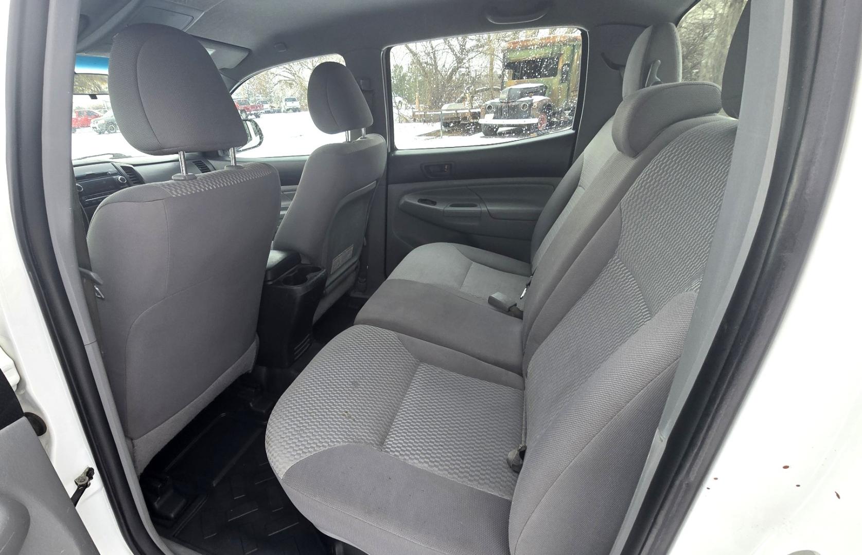 2012 White /Black Toyota Tacoma Double Cab V6 4WD (3TMLU4EN4CM) with an 4.0L V6 DOHC 24V engine, 6-Speed Automatic transmission, located at 450 N Russell, Missoula, MT, 59801, (406) 543-6600, 46.874496, -114.017433 - Very Reliable and Desirable 4WD Toyota Tacoma Crew Cab. 4.0L V6 Engine. 6 Speed Automatic Transmission. Air. Cruise. Tilt. Power Windows and Locks. AM FM CD Player. Body is straight. . Very minor rip in the drivers seat. Nice Tires and Wheels. We Finance through local Credit Unions. We do NOT of - Photo#10