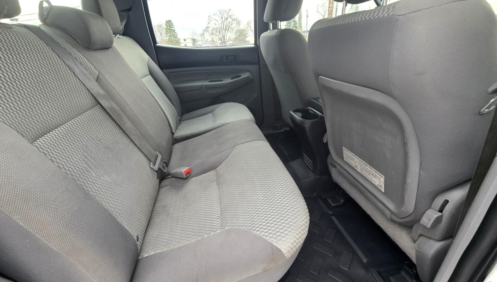 2012 White /Black Toyota Tacoma Double Cab V6 4WD (3TMLU4EN4CM) with an 4.0L V6 DOHC 24V engine, 6-Speed Automatic transmission, located at 450 N Russell, Missoula, MT, 59801, (406) 543-6600, 46.874496, -114.017433 - Very Reliable and Desirable 4WD Toyota Tacoma Crew Cab. 4.0L V6 Engine. 6 Speed Automatic Transmission. Air. Cruise. Tilt. Power Windows and Locks. AM FM CD Player. Body is straight. . Very minor rip in the drivers seat. Nice Tires and Wheels. We Finance through local Credit Unions. We do NOT of - Photo#12