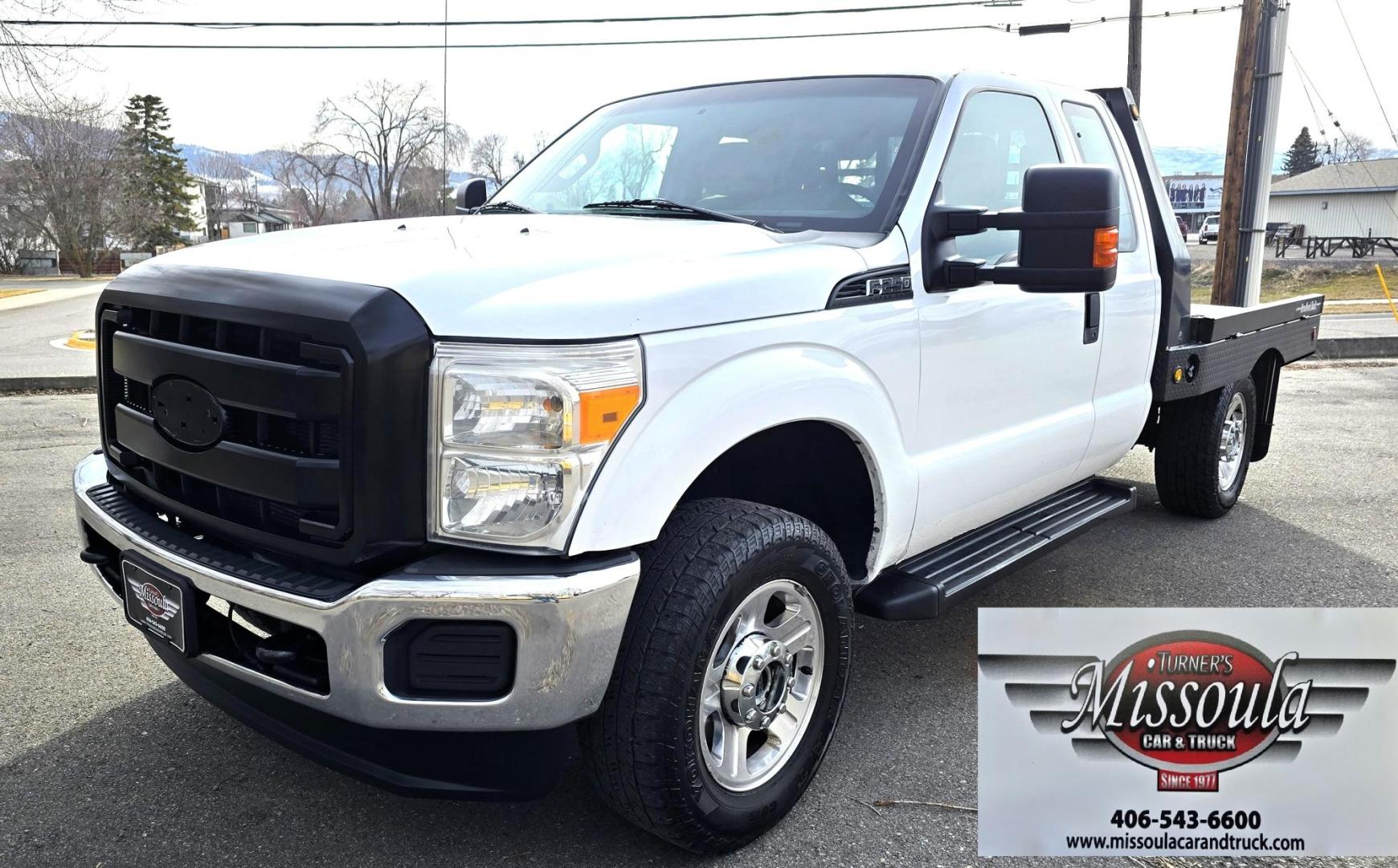2014 White /Gray Ford F-250 SD XL SuperCab Flatbed 4WD (1FT7X2B62EE) with an 6.2L V8 OHV 16V engine, 6-Speed Automatic transmission, located at 450 N Russell, Missoula, MT, 59801, (406) 543-6600, 46.874496, -114.017433 - Beefy 3/4 Ton Ford 4WD. 6.2L V8 Engine. 6 Speed Automatic Transmission. Nice heavy duty Bradford Flatbed with Gooseneck slot. Deck measures 85" Wide by 102" Long. Air. Cruise. Tilt. Power Windows and Locks. AM FM CD Player. Bluetooth Phone Connection. 4 Wheel Drive has Manual Locking Hubs. Clean Tit - Photo#5