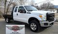 2014 White /Gray Ford F-250 SD XL SuperCab Flatbed 4WD (1FT7X2B62EE) with an 6.2L V8 OHV 16V engine, 6-Speed Automatic transmission, located at 450 N Russell, Missoula, MT, 59801, (406) 543-6600, 46.874496, -114.017433 - Beefy 3/4 Ton Ford 4WD. 6.2L V8 Engine. 6 Speed Automatic Transmission. Nice heavy duty Bradford Flatbed with Gooseneck slot. Deck measures 85" Wide by 102" Long. Air. Cruise. Tilt. Power Windows and Locks. AM FM CD Player. Bluetooth Phone Connection. 4 Wheel Drive has Manual Locking Hubs. Clean Tit - Photo#6