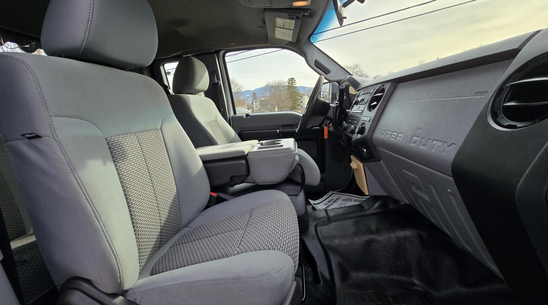 2014 White /Gray Ford F-250 SD XL SuperCab Flatbed 4WD (1FT7X2B62EE) with an 6.2L V8 OHV 16V engine, 6-Speed Automatic transmission, located at 450 N Russell, Missoula, MT, 59801, (406) 543-6600, 46.874496, -114.017433 - Beefy 3/4 Ton Ford 4WD. 6.2L V8 Engine. 6 Speed Automatic Transmission. Nice heavy duty Bradford Flatbed with Gooseneck slot. Deck measures 85" Wide by 102" Long. Air. Cruise. Tilt. Power Windows and Locks. AM FM CD Player. Bluetooth Phone Connection. 4 Wheel Drive has Manual Locking Hubs. Clean Tit - Photo#10