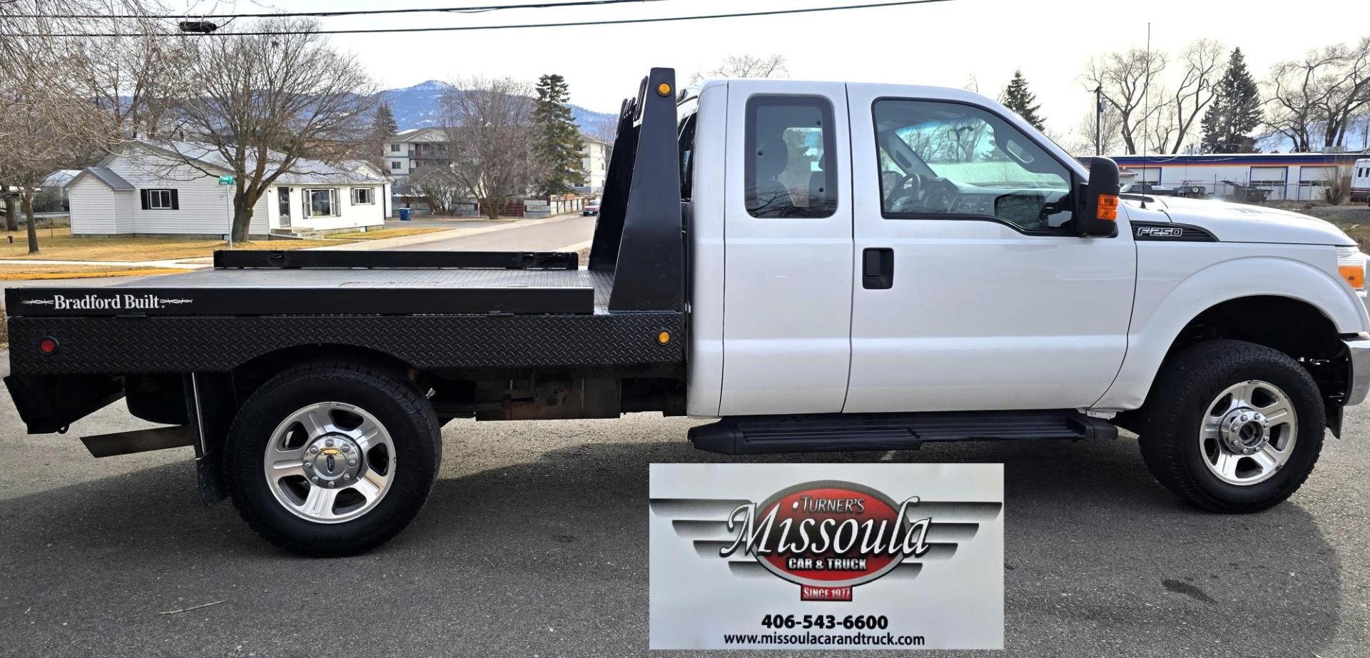2014 White /Gray Ford F-250 SD XL SuperCab Flatbed 4WD (1FT7X2B62EE) with an 6.2L V8 OHV 16V engine, 6-Speed Automatic transmission, located at 450 N Russell, Missoula, MT, 59801, (406) 543-6600, 46.874496, -114.017433 - Beefy 3/4 Ton Ford 4WD. 6.2L V8 Engine. 6 Speed Automatic Transmission. Nice heavy duty Bradford Flatbed with Gooseneck slot. Deck measures 85" Wide by 102" Long. Air. Cruise. Tilt. Power Windows and Locks. AM FM CD Player. Bluetooth Phone Connection. 4 Wheel Drive has Manual Locking Hubs. Clean Tit - Photo#8