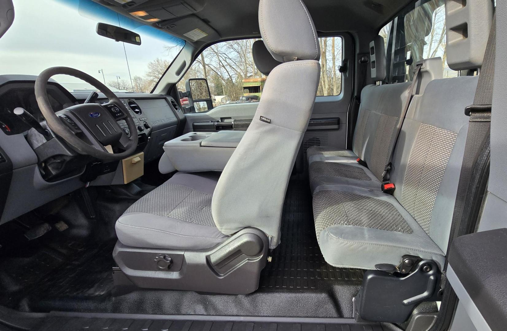 2014 White /Gray Ford F-250 SD XL SuperCab Flatbed 4WD (1FT7X2B62EE) with an 6.2L V8 OHV 16V engine, 6-Speed Automatic transmission, located at 450 N Russell, Missoula, MT, 59801, (406) 543-6600, 46.874496, -114.017433 - Beefy 3/4 Ton Ford 4WD. 6.2L V8 Engine. 6 Speed Automatic Transmission. Nice heavy duty Bradford Flatbed with Gooseneck slot. Deck measures 85" Wide by 102" Long. Air. Cruise. Tilt. Power Windows and Locks. AM FM CD Player. Bluetooth Phone Connection. 4 Wheel Drive has Manual Locking Hubs. Clean Tit - Photo#14