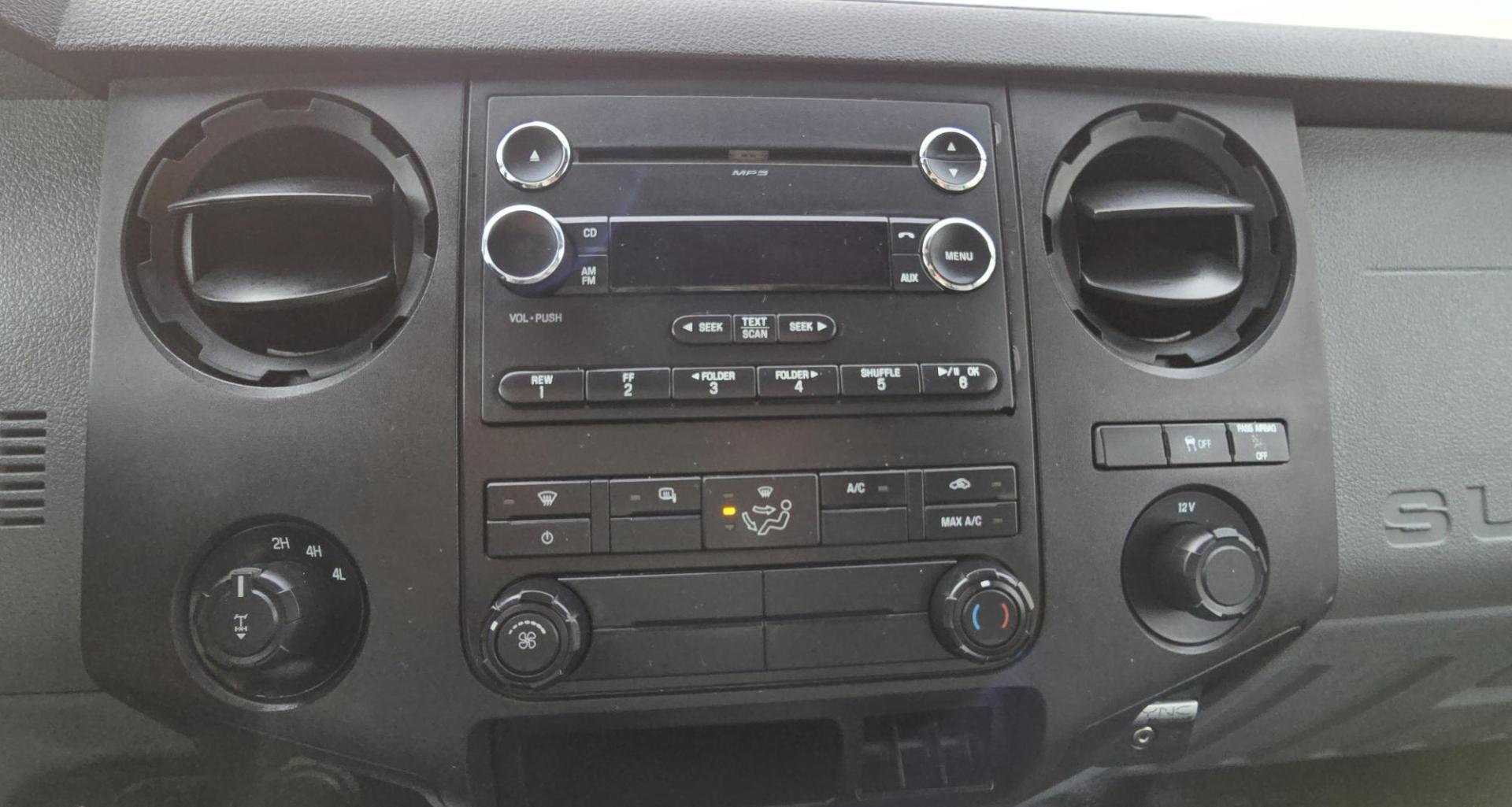 2014 White /Gray Ford F-250 SD XL SuperCab Flatbed 4WD (1FT7X2B62EE) with an 6.2L V8 OHV 16V engine, 6-Speed Automatic transmission, located at 450 N Russell, Missoula, MT, 59801, (406) 543-6600, 46.874496, -114.017433 - Beefy 3/4 Ton Ford 4WD. 6.2L V8 Engine. 6 Speed Automatic Transmission. Nice heavy duty Bradford Flatbed with Gooseneck slot. Deck measures 85" Wide by 102" Long. Air. Cruise. Tilt. Power Windows and Locks. AM FM CD Player. Bluetooth Phone Connection. 4 Wheel Drive has Manual Locking Hubs. Clean Tit - Photo#17