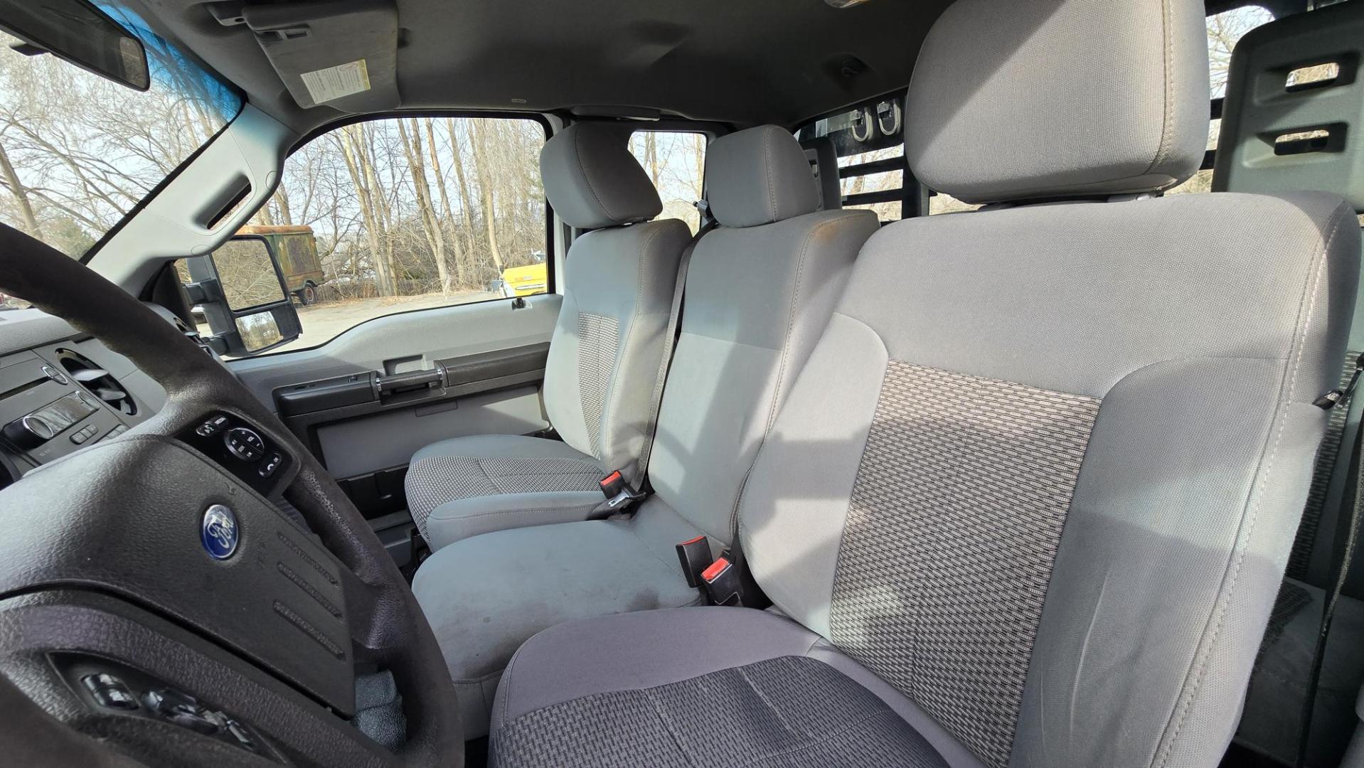 2014 White /Gray Ford F-250 SD XL SuperCab Flatbed 4WD (1FT7X2B62EE) with an 6.2L V8 OHV 16V engine, 6-Speed Automatic transmission, located at 450 N Russell, Missoula, MT, 59801, (406) 543-6600, 46.874496, -114.017433 - Beefy 3/4 Ton Ford 4WD. 6.2L V8 Engine. 6 Speed Automatic Transmission. Nice heavy duty Bradford Flatbed with Gooseneck slot. Deck measures 85" Wide by 102" Long. Air. Cruise. Tilt. Power Windows and Locks. AM FM CD Player. Bluetooth Phone Connection. 4 Wheel Drive has Manual Locking Hubs. Clean Tit - Photo#15