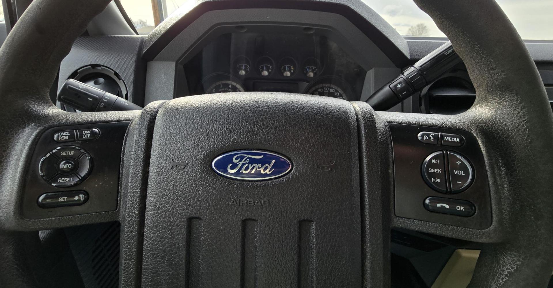 2014 White /Gray Ford F-250 SD XL SuperCab Flatbed 4WD (1FT7X2B62EE) with an 6.2L V8 OHV 16V engine, 6-Speed Automatic transmission, located at 450 N Russell, Missoula, MT, 59801, (406) 543-6600, 46.874496, -114.017433 - Beefy 3/4 Ton Ford 4WD. 6.2L V8 Engine. 6 Speed Automatic Transmission. Nice heavy duty Bradford Flatbed with Gooseneck slot. Deck measures 85" Wide by 102" Long. Air. Cruise. Tilt. Power Windows and Locks. AM FM CD Player. Bluetooth Phone Connection. 4 Wheel Drive has Manual Locking Hubs. Clean Tit - Photo#18