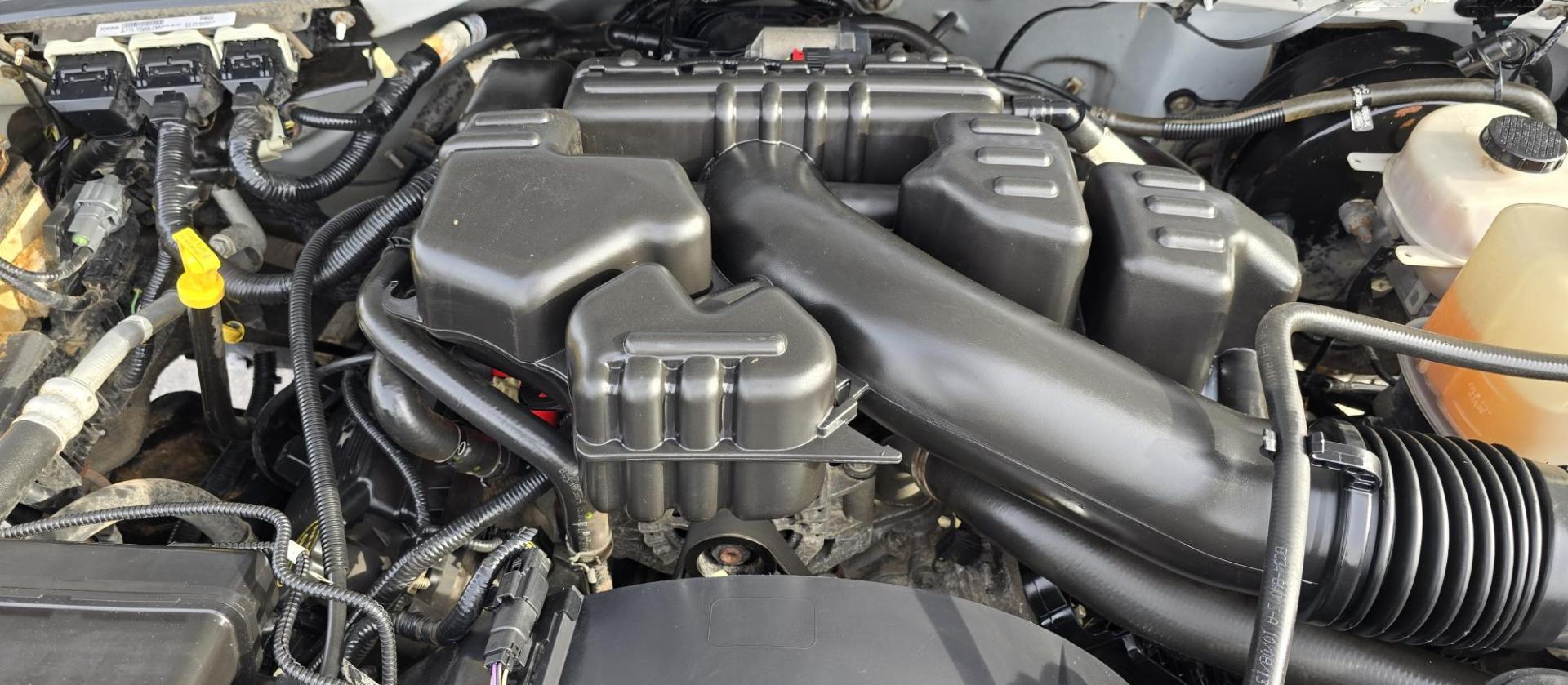 2014 White /Gray Ford F-250 SD XL SuperCab Flatbed 4WD (1FT7X2B62EE) with an 6.2L V8 OHV 16V engine, 6-Speed Automatic transmission, located at 450 N Russell, Missoula, MT, 59801, (406) 543-6600, 46.874496, -114.017433 - Beefy 3/4 Ton Ford 4WD. 6.2L V8 Engine. 6 Speed Automatic Transmission. Nice heavy duty Bradford Flatbed with Gooseneck slot. Deck measures 85" Wide by 102" Long. Air. Cruise. Tilt. Power Windows and Locks. AM FM CD Player. Bluetooth Phone Connection. 4 Wheel Drive has Manual Locking Hubs. Clean Tit - Photo#19