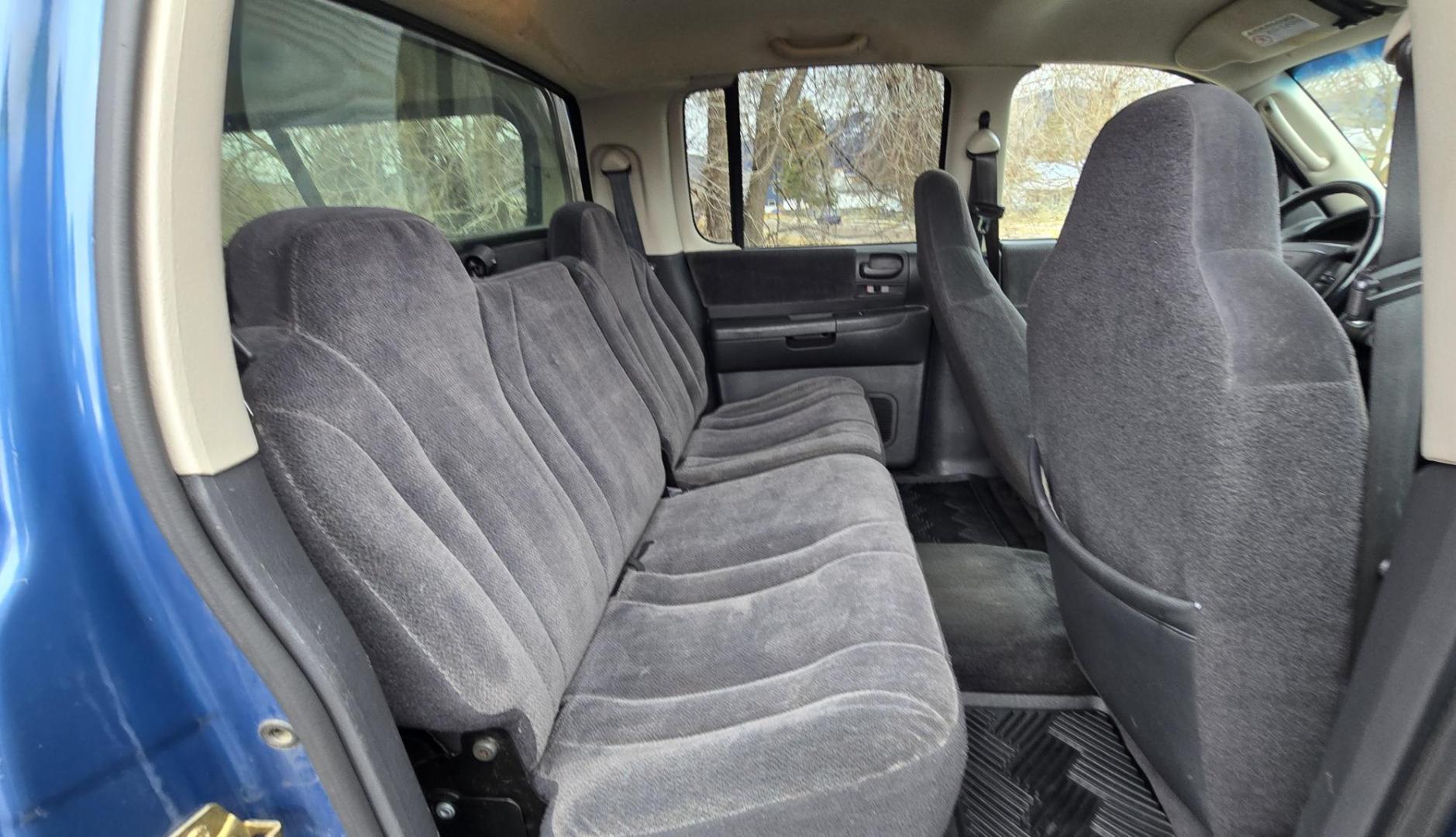 2003 Blue /Gray Dodge Dakota SLT (1D7HG48N63S) with an 4.7L V8 SOHC 16V engine, Automatic with Overdrive transmission, located at 450 N Russell, Missoula, MT, 59801, (406) 543-6600, 46.874496, -114.017433 - Nice mid-size 4WD. 4.7l V8 Offers Power and Economy. Automatic Transmission. Air. Cruise. Tilt. Power Windows and Locks.AM FM CD Player. Excellent Tires. Has a dent on the passenger side and the Center arm Rest is Missing. Because of the age of this vehicle, our lenders do NOT offer financing. - Photo#13