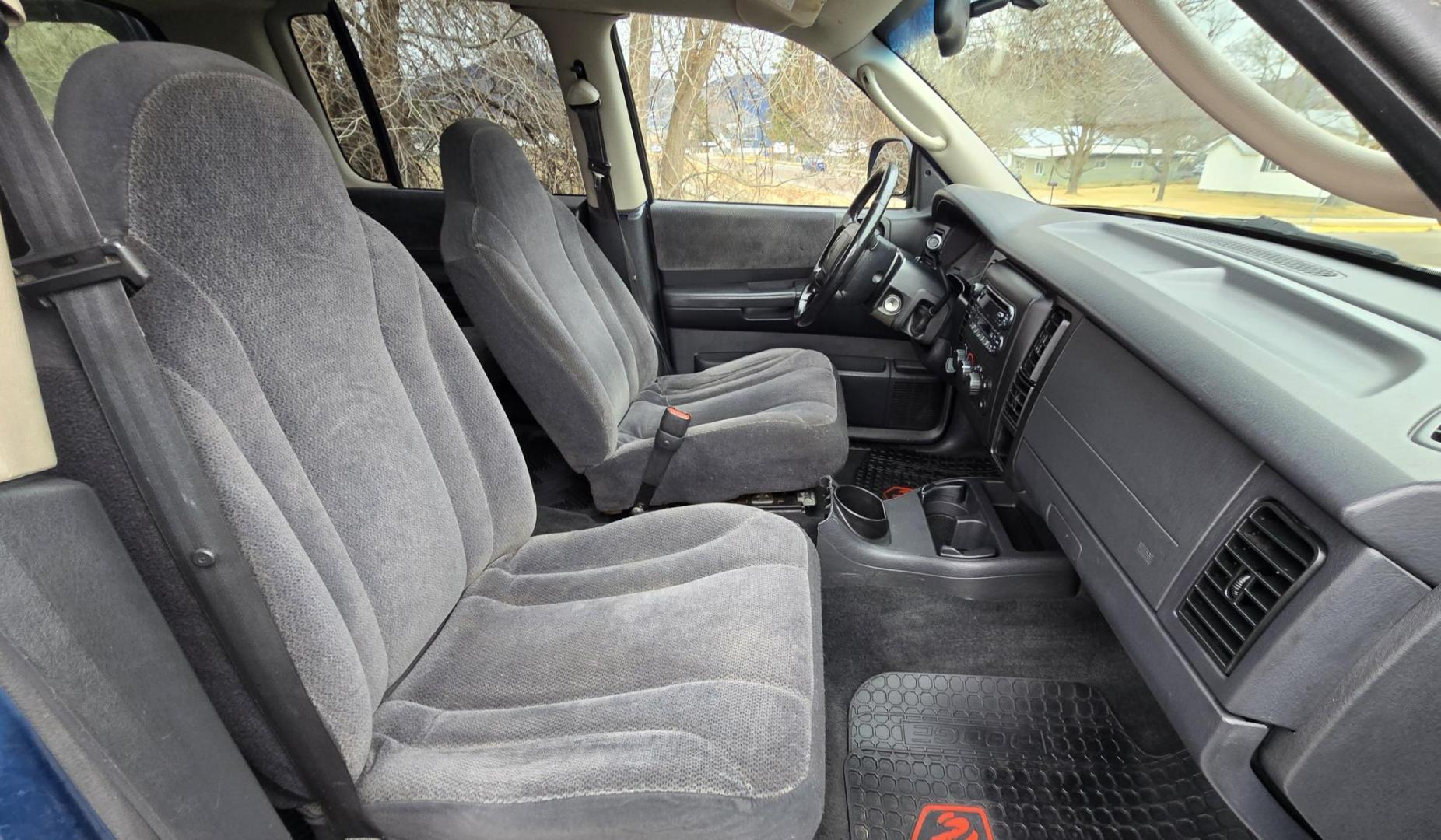 2003 Blue /Gray Dodge Dakota SLT (1D7HG48N63S) with an 4.7L V8 SOHC 16V engine, Automatic with Overdrive transmission, located at 450 N Russell, Missoula, MT, 59801, (406) 543-6600, 46.874496, -114.017433 - Nice mid-size 4WD. 4.7l V8 Offers Power and Economy. Automatic Transmission. Air. Cruise. Tilt. Power Windows and Locks.AM FM CD Player. Excellent Tires. Has a dent on the passenger side and the Center arm Rest is Missing. Because of the age of this vehicle, our lenders do NOT offer financing. - Photo#11