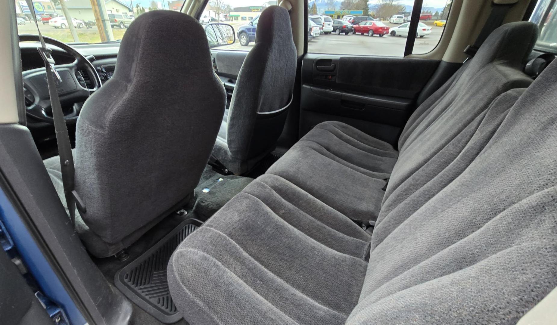 2003 Blue /Gray Dodge Dakota SLT (1D7HG48N63S) with an 4.7L V8 SOHC 16V engine, Automatic with Overdrive transmission, located at 450 N Russell, Missoula, MT, 59801, (406) 543-6600, 46.874496, -114.017433 - Nice mid-size 4WD. 4.7l V8 Offers Power and Economy. Automatic Transmission. Air. Cruise. Tilt. Power Windows and Locks.AM FM CD Player. Excellent Tires. Has a dent on the passenger side and the Center arm Rest is Missing. Because of the age of this vehicle, our lenders do NOT offer financing. - Photo#10