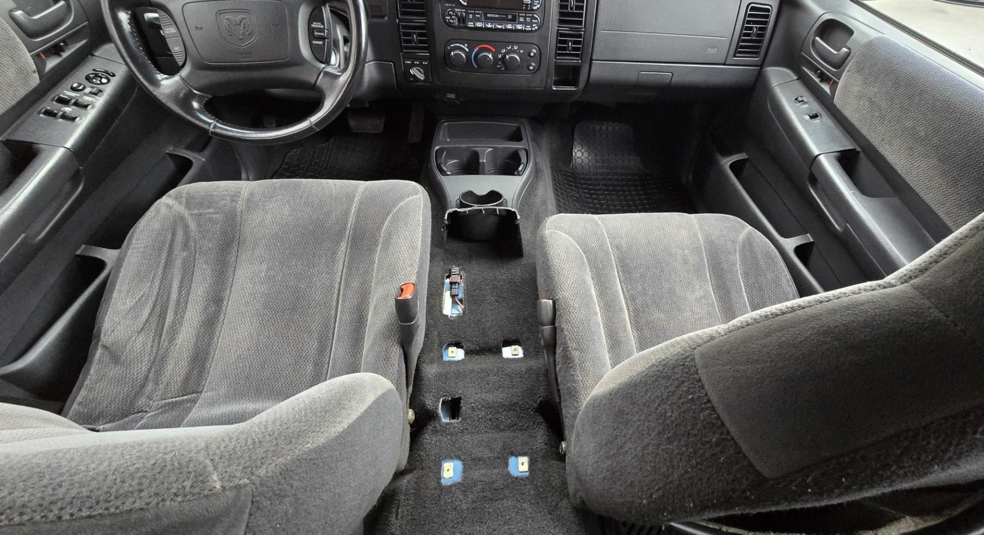 2003 Blue /Gray Dodge Dakota SLT (1D7HG48N63S) with an 4.7L V8 SOHC 16V engine, Automatic with Overdrive transmission, located at 450 N Russell, Missoula, MT, 59801, (406) 543-6600, 46.874496, -114.017433 - Nice mid-size 4WD. 4.7l V8 Offers Power and Economy. Automatic Transmission. Air. Cruise. Tilt. Power Windows and Locks.AM FM CD Player. Excellent Tires. Has a dent on the passenger side and the Center arm Rest is Missing. Because of the age of this vehicle, our lenders do NOT offer financing. - Photo#9