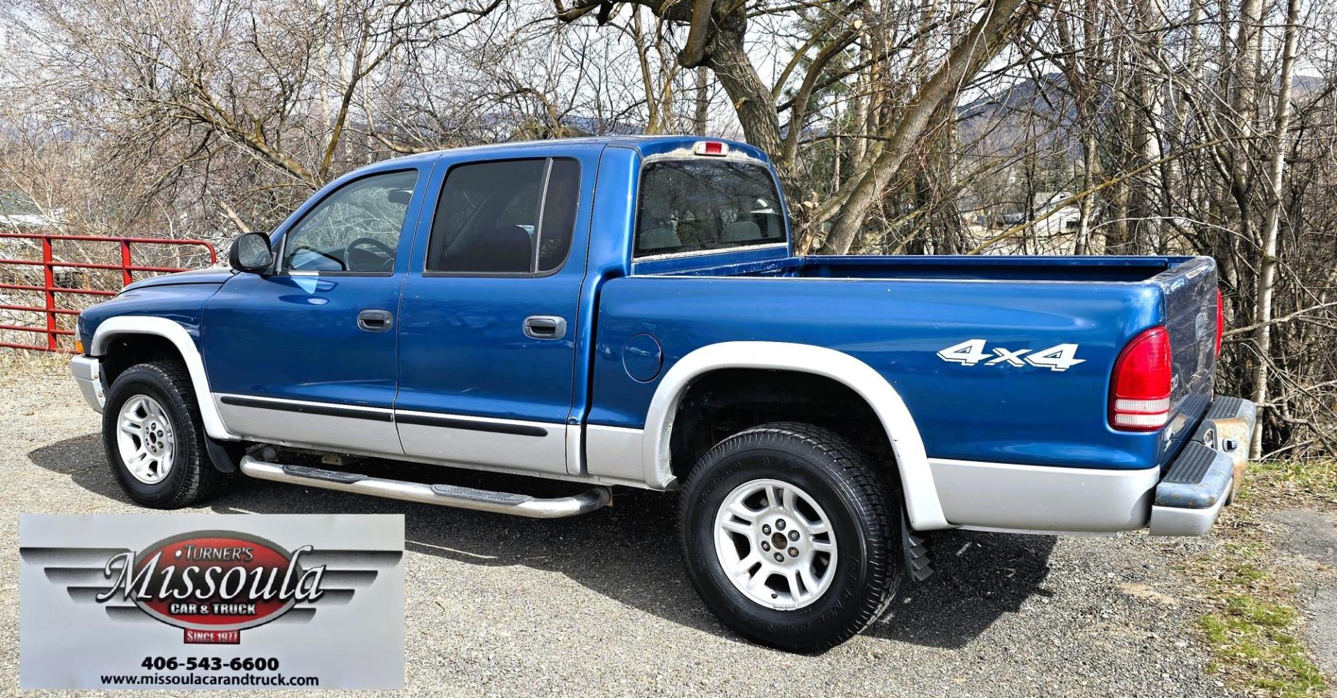 2003 Blue /Gray Dodge Dakota SLT (1D7HG48N63S) with an 4.7L V8 SOHC 16V engine, Automatic with Overdrive transmission, located at 450 N Russell, Missoula, MT, 59801, (406) 543-6600, 46.874496, -114.017433 - Nice mid-size 4WD. 4.7l V8 Offers Power and Economy. Automatic Transmission. Air. Cruise. Tilt. Power Windows and Locks.AM FM CD Player. Excellent Tires. Has a dent on the passenger side and the Center arm Rest is Missing. Because of the age of this vehicle, our lenders do NOT offer financing. - Photo#2