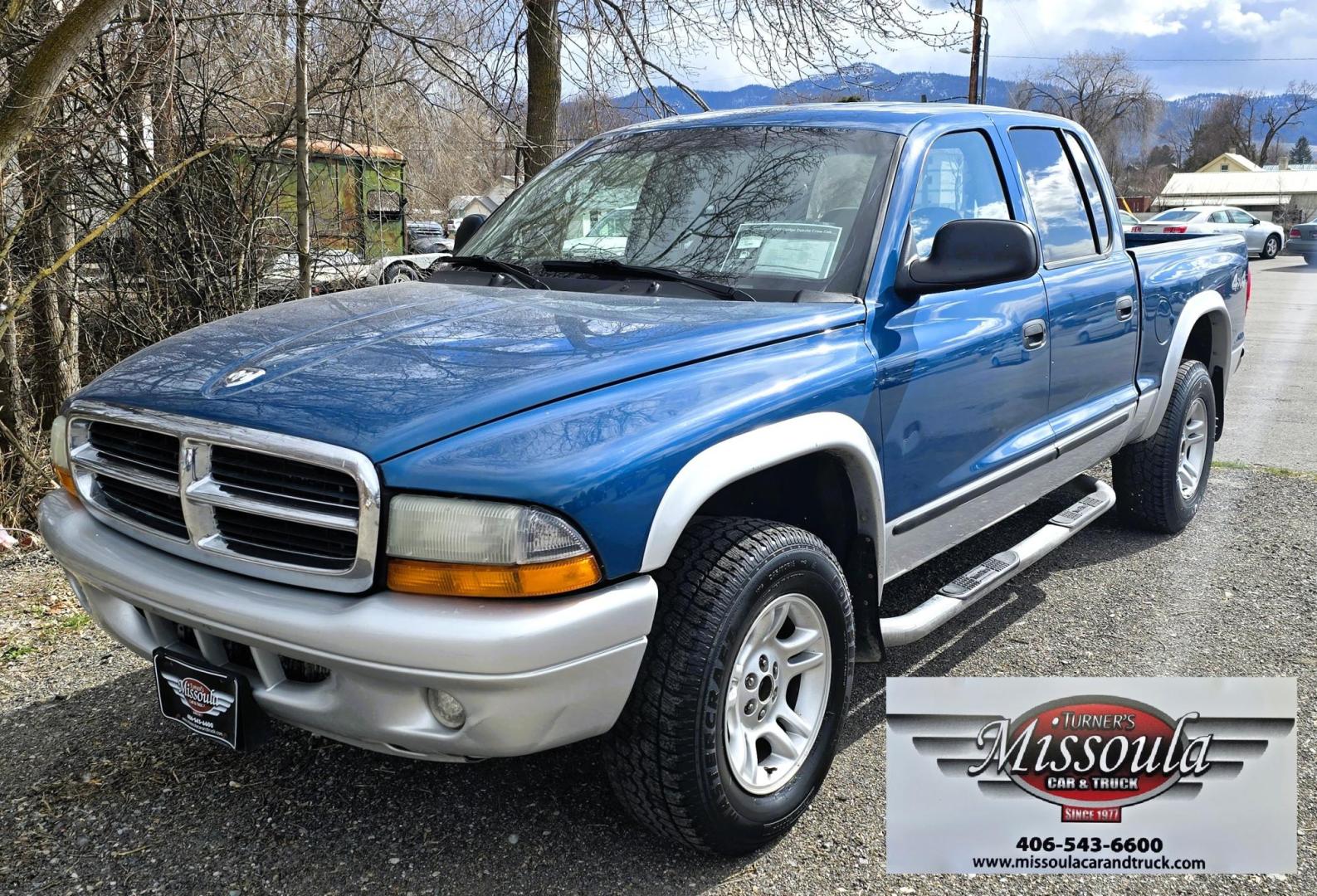 2003 Blue /Gray Dodge Dakota SLT (1D7HG48N63S) with an 4.7L V8 SOHC 16V engine, Automatic with Overdrive transmission, located at 450 N Russell, Missoula, MT, 59801, (406) 543-6600, 46.874496, -114.017433 - Nice mid-size 4WD. 4.7l V8 Offers Power and Economy. Automatic Transmission. Air. Cruise. Tilt. Power Windows and Locks.AM FM CD Player. Excellent Tires. Has a dent on the passenger side and the Center arm Rest is Missing. Because of the age of this vehicle, our lenders do NOT offer financing. - Photo#4
