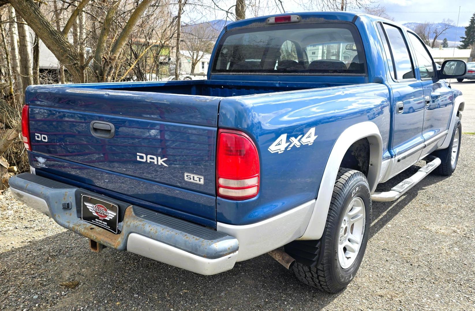 2003 Blue /Gray Dodge Dakota SLT (1D7HG48N63S) with an 4.7L V8 SOHC 16V engine, Automatic with Overdrive transmission, located at 450 N Russell, Missoula, MT, 59801, (406) 543-6600, 46.874496, -114.017433 - Nice mid-size 4WD. 4.7l V8 Offers Power and Economy. Automatic Transmission. Air. Cruise. Tilt. Power Windows and Locks.AM FM CD Player. Excellent Tires. Has a dent on the passenger side and the Center arm Rest is Missing. Because of the age of this vehicle, our lenders do NOT offer financing. - Photo#8
