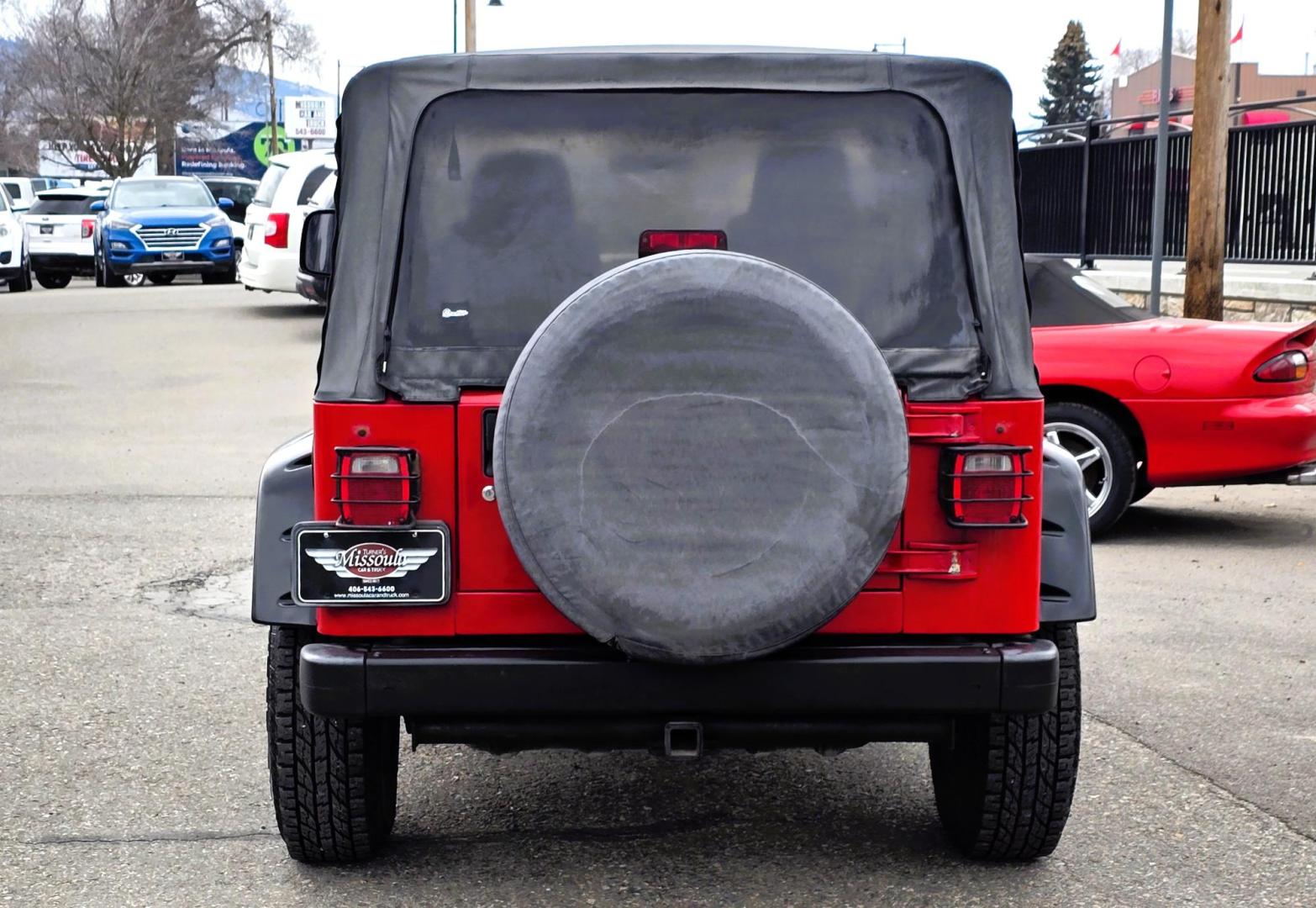 2004 Red Jeep Wrangler Columbia Edition (1J4FA39S54P) with an 4.0L L6 OHV 12V engine, Automatic transmission, located at 450 N Russell, Missoula, MT, 59801, (406) 543-6600, 46.874496, -114.017433 - Excellent Condition Jeep Wrangler X in a Rare Columbia Edition. Comes with the near Bullet Proof 4.0L Straight 6 Engine. Automatic Transmission that was replaced about 10K miles ago. Air Conditioning. Cloth Top. Has a winch on the front but no remote cable to run it. Does not have a back seat. AM FM - Photo#4