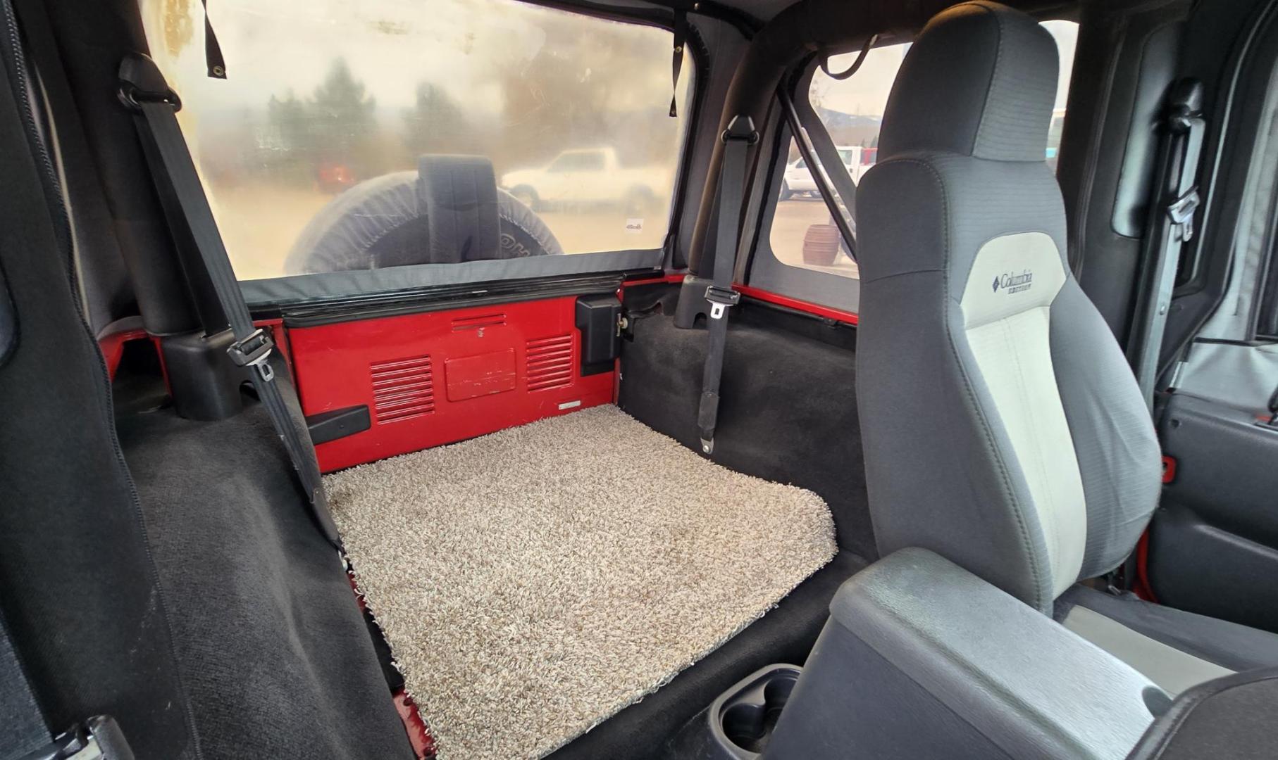 2004 Red Jeep Wrangler Columbia Edition (1J4FA39S54P) with an 4.0L L6 OHV 12V engine, Automatic transmission, located at 450 N Russell, Missoula, MT, 59801, (406) 543-6600, 46.874496, -114.017433 - Excellent Condition Jeep Wrangler X in a Rare Columbia Edition. Comes with the near Bullet Proof 4.0L Straight 6 Engine. Automatic Transmission that was replaced about 10K miles ago. Air Conditioning. Cloth Top. Has a winch on the front but no remote cable to run it. Does not have a back seat. AM FM - Photo#10