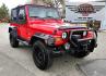 2004 Red Jeep Wrangler Columbia Edition (1J4FA39S54P) with an 4.0L L6 OHV 12V engine, Automatic transmission, located at 450 N Russell, Missoula, MT, 59801, (406) 543-6600, 46.874496, -114.017433 - Excellent Condition Jeep Wrangler X in a Rare Columbia Edition. Comes with the near Bullet Proof 4.0L Straight 6 Engine. Automatic Transmission that was replaced about 10K miles ago. Air Conditioning. Cloth Top. Has a winch on the front but no remote cable to run it. Does not have a back seat. AM FM - Photo#8