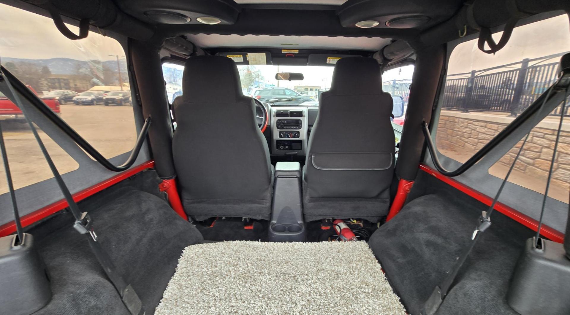 2004 Red Jeep Wrangler Columbia Edition (1J4FA39S54P) with an 4.0L L6 OHV 12V engine, Automatic transmission, located at 450 N Russell, Missoula, MT, 59801, (406) 543-6600, 46.874496, -114.017433 - Excellent Condition Jeep Wrangler X in a Rare Columbia Edition. Comes with the near Bullet Proof 4.0L Straight 6 Engine. Automatic Transmission that was replaced about 10K miles ago. Air Conditioning. Cloth Top. Has a winch on the front but no remote cable to run it. Does not have a back seat. AM FM - Photo#11