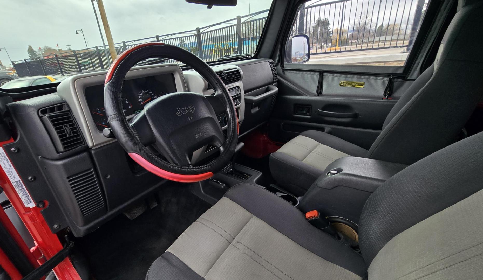 2004 Red Jeep Wrangler Columbia Edition (1J4FA39S54P) with an 4.0L L6 OHV 12V engine, Automatic transmission, located at 450 N Russell, Missoula, MT, 59801, (406) 543-6600, 46.874496, -114.017433 - Excellent Condition Jeep Wrangler X in a Rare Columbia Edition. Comes with the near Bullet Proof 4.0L Straight 6 Engine. Automatic Transmission that was replaced about 10K miles ago. Air Conditioning. Cloth Top. Has a winch on the front but no remote cable to run it. Does not have a back seat. AM FM - Photo#12