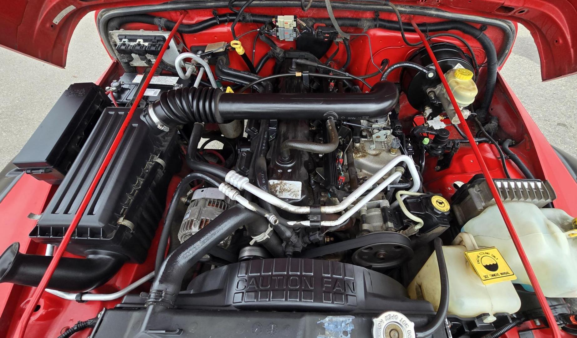 2004 Red Jeep Wrangler Columbia Edition (1J4FA39S54P) with an 4.0L L6 OHV 12V engine, Automatic transmission, located at 450 N Russell, Missoula, MT, 59801, (406) 543-6600, 46.874496, -114.017433 - Excellent Condition Jeep Wrangler X in a Rare Columbia Edition. Comes with the near Bullet Proof 4.0L Straight 6 Engine. Automatic Transmission that was replaced about 10K miles ago. Air Conditioning. Cloth Top. Has a winch on the front but no remote cable to run it. Does not have a back seat. AM FM - Photo#16