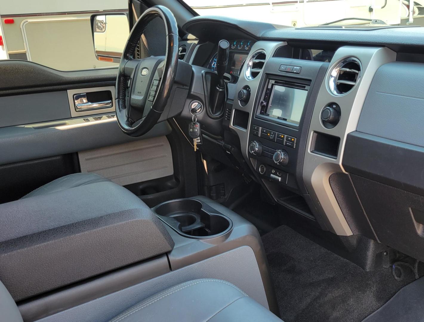 2011 White /Black Ford F-150 XLT (1FTFW1EF0BK) with an 5.0L V8 engine, 4-Speed Automatic transmission, located at 450 N Russell, Missoula, MT, 59801, (406) 543-6600, 46.874496, -114.017433 - Clean 4WD Truck. 5.0L V8 engine. 4 Speed Automatic Transmission. Air. Cruise. Tilt. Power Windows and Locks. Backup Camera. Running Boards. Towing. Tonneau Cover. Nice Highway Tires. Remote Start. - Photo#11