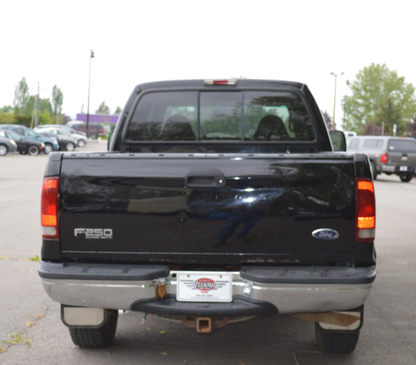 1999 Black Ford F-250 SD Lariat Crew Cab LWB 4WD (1FTNW21S7XE) with an 6.8L V10 SOHC 20V engine, Automatic transmission, located at 450 N Russell, Missoula, MT, 59801, (406) 543-6600, 46.874496, -114.017433 - Great running truck. Had a rebuilt transmission installed at 158K Miles. Has the very desirable Triton V10 Engine. Automatic Transmission. Leather Seats. Air Conditioning. Cruise. Tilt. Bed Liner. Running Boards. - Photo #5