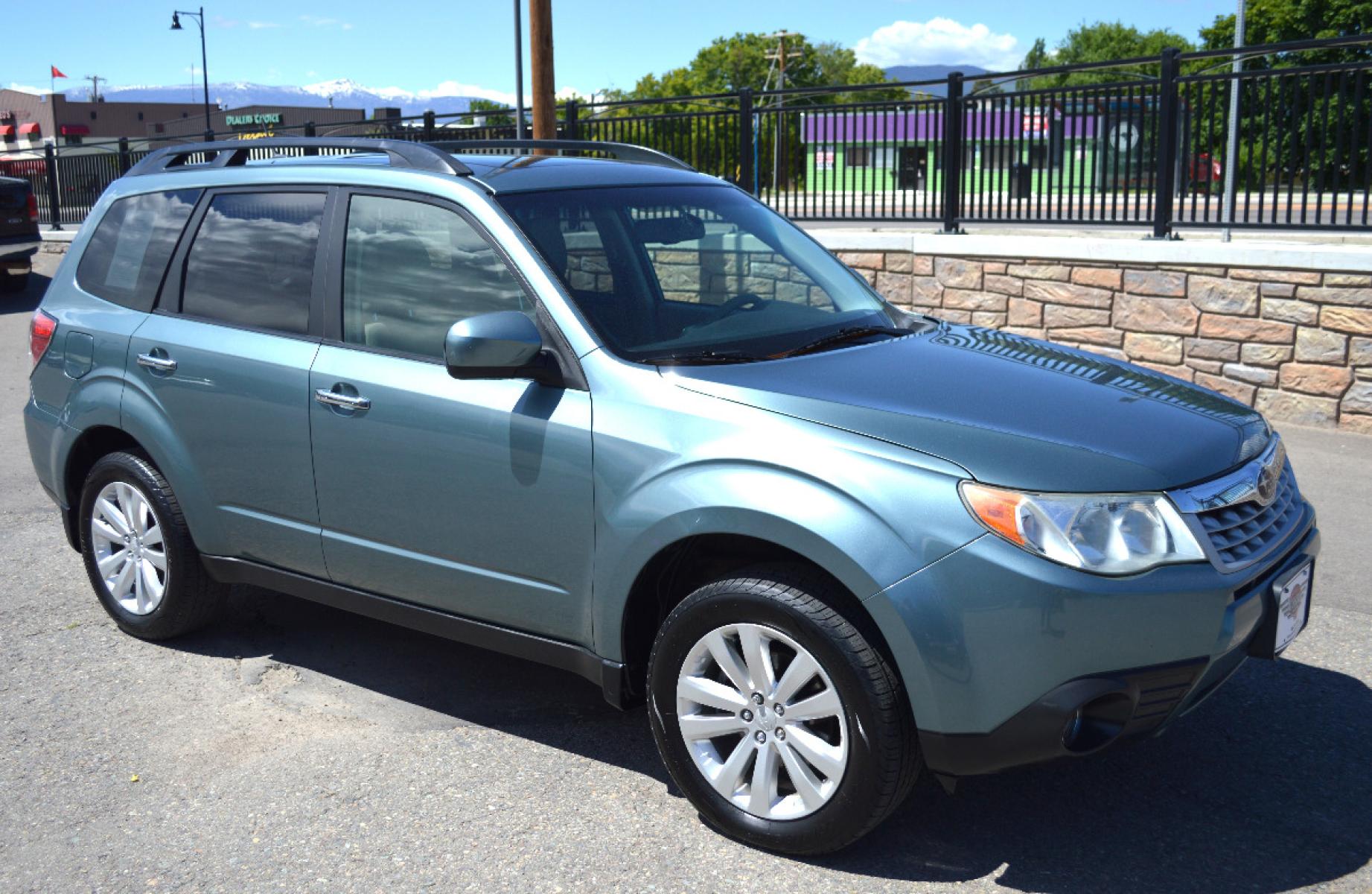 2013 Green Subaru Forester 2.5X Premium (JF2SHADC6DG) with an 2.5L H4 SOHC 16V engine, 5-Speed Manual transmission, located at 450 N Russell, Missoula, MT, 59801, (406) 543-6600, 46.874496, -114.017433 - 2013 Forester. Has Timing Chain not timing belt. 5 Speed Manual transmission. Power Sunroof. Air Conditioning. Heated Seats. Cruise. Tilt. Bluetooth. Backup Camera. - Photo #1