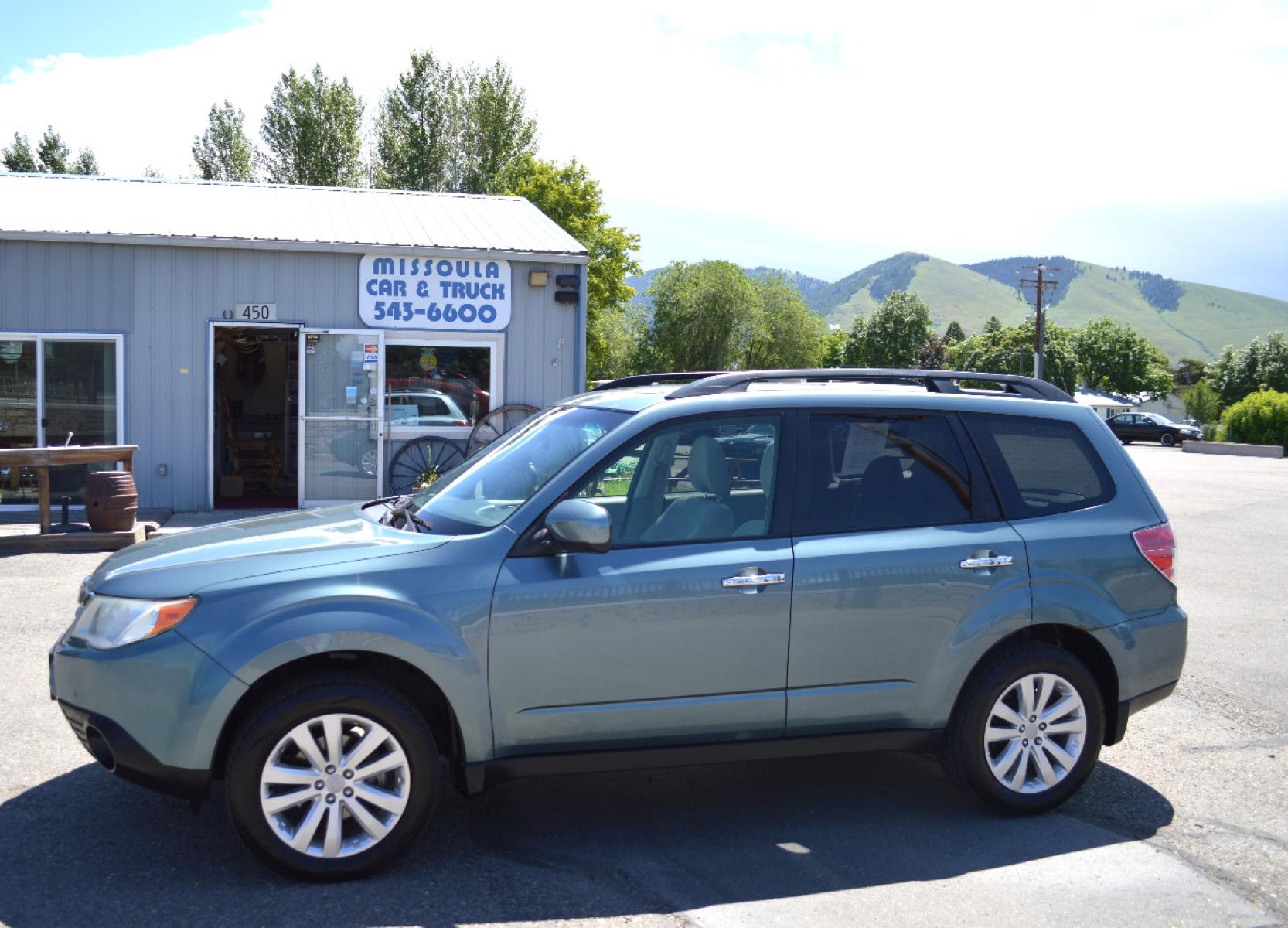 2013 Green Subaru Forester 2.5X Premium (JF2SHADC6DG) with an 2.5L H4 SOHC 16V engine, 5-Speed Manual transmission, located at 450 N Russell, Missoula, MT, 59801, (406) 543-6600, 46.874496, -114.017433 - 2013 Forester. Has Timing Chain not timing belt. 5 Speed Manual transmission. Power Sunroof. Air Conditioning. Heated Seats. Cruise. Tilt. Bluetooth. Backup Camera. - Photo #5