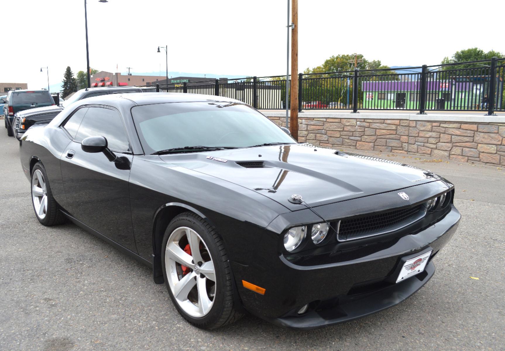 2010 Black /Black Dodge Challenger SRT8 (2B3CJ7DW6AH) with an 6.1L V8 OHV 16V engine, 5-Speed Automatic transmission, located at 450 N Russell, Missoula, MT, 59801, (406) 543-6600, 46.874496, -114.017433 - Sexy Beast of a Car. 6.1 Hemi V8. Automatic Transmission. Power Sunroof. Air Conditioning. Bluetooth. Navigation. Leather Heated Seats. Power Windows. Cruise. Tilt. - Photo #1