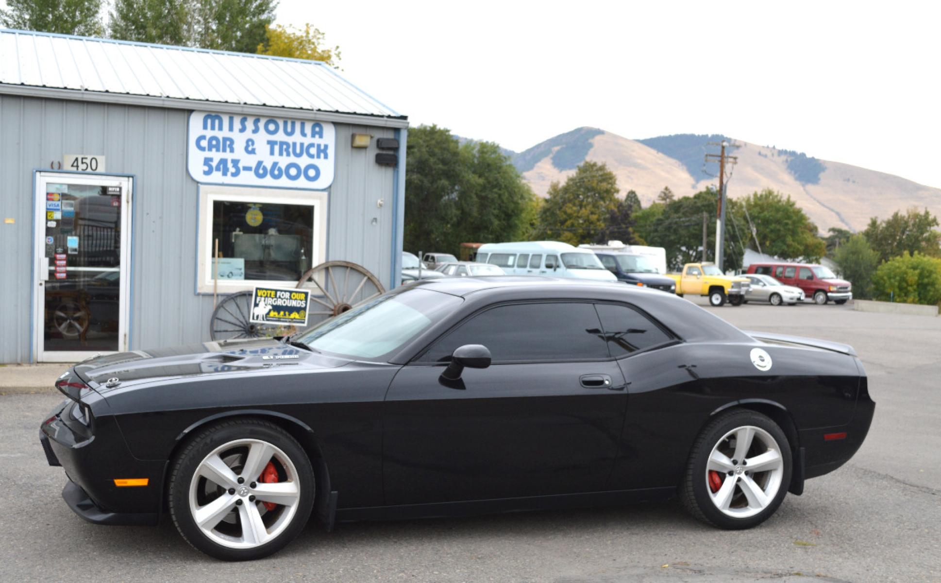 2010 Black /Black Dodge Challenger SRT8 (2B3CJ7DW6AH) with an 6.1L V8 OHV 16V engine, 5-Speed Automatic transmission, located at 450 N Russell, Missoula, MT, 59801, (406) 543-6600, 46.874496, -114.017433 - Sexy Beast of a Car. 6.1 Hemi V8. Automatic Transmission. Power Sunroof. Air Conditioning. Bluetooth. Navigation. Leather Heated Seats. Power Windows. Cruise. Tilt. - Photo #2