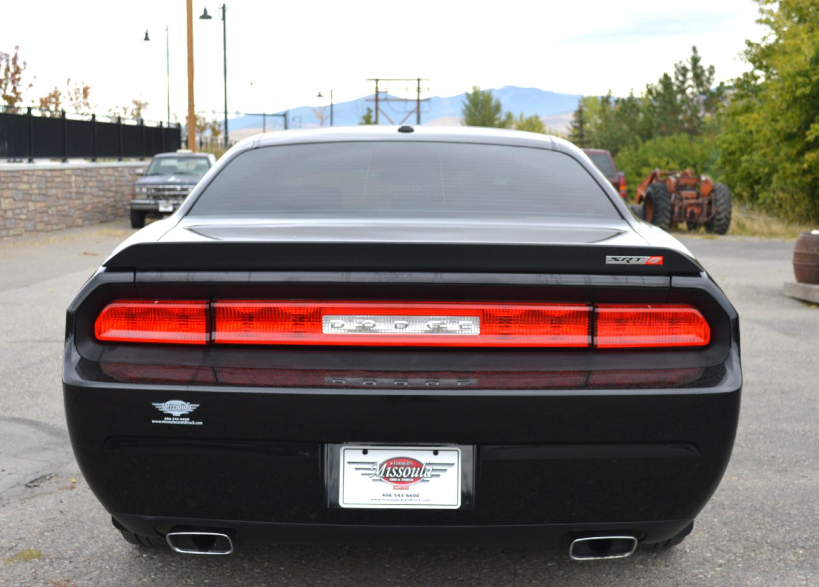 2010 Black /Black Dodge Challenger SRT8 (2B3CJ7DW6AH) with an 6.1L V8 OHV 16V engine, 5-Speed Automatic transmission, located at 450 N Russell, Missoula, MT, 59801, (406) 543-6600, 46.874496, -114.017433 - Sexy Beast of a Car. 6.1 Hemi V8. Automatic Transmission. Power Sunroof. Air Conditioning. Bluetooth. Navigation. Leather Heated Seats. Power Windows. Cruise. Tilt. - Photo #6