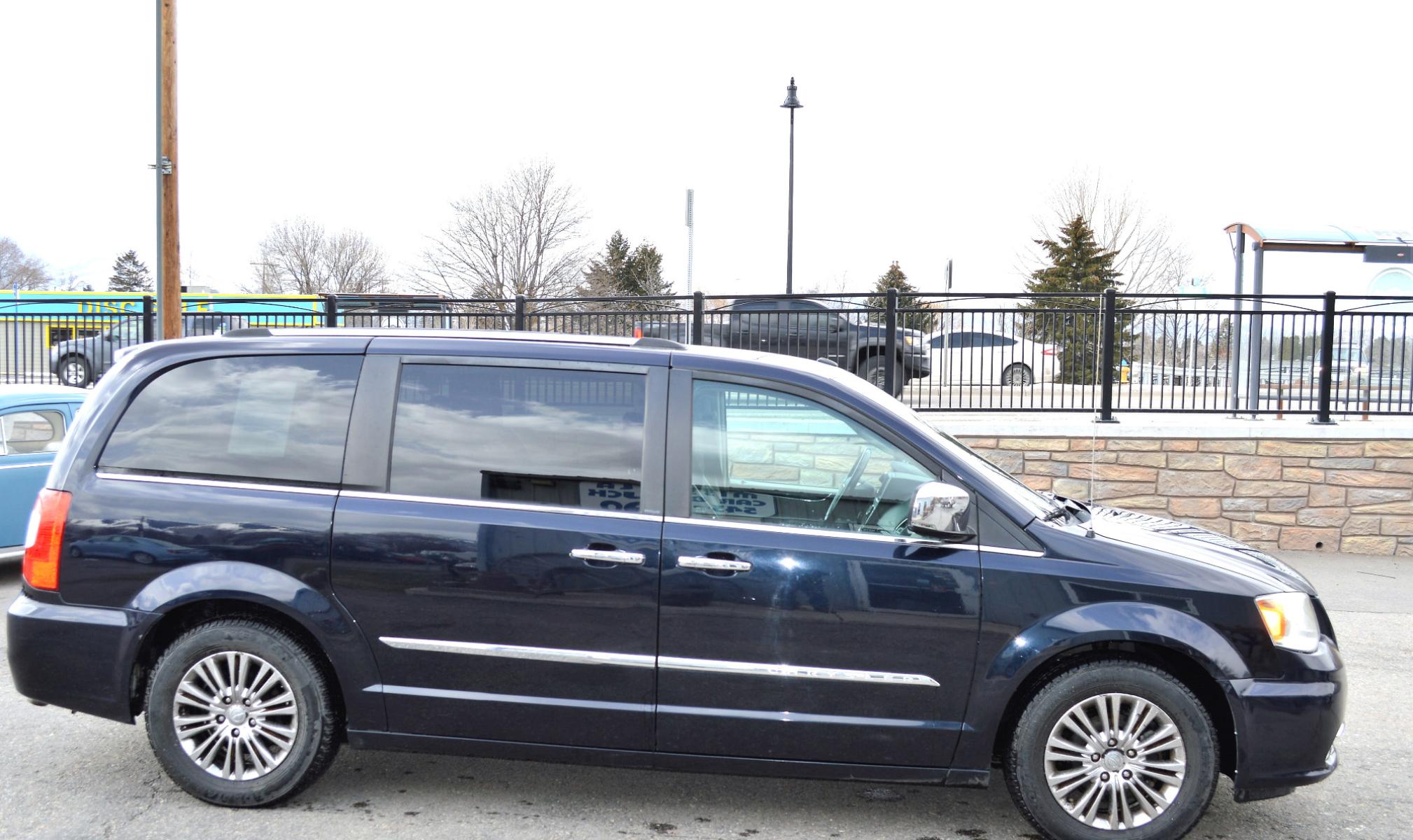 2011 Blue /Black Chrysler Town & Country Limited (2A4RR6DG6BR) with an 3.6L V6 DOHC 24V engine, 6-Speed Automatic transmission, located at 450 N Russell, Missoula, MT, 59801, (406) 543-6600, 46.874496, -114.017433 - Beautiful Van. 3rd Row Seating. Leather Seats. Rear Entertainment. Power Sliding Doors on both sides. Air. Cruise. Tilt. Navigation. Bluetooth. Stow and Go Seats. Heated Seats. Heated Steering Wheel. - Photo #4