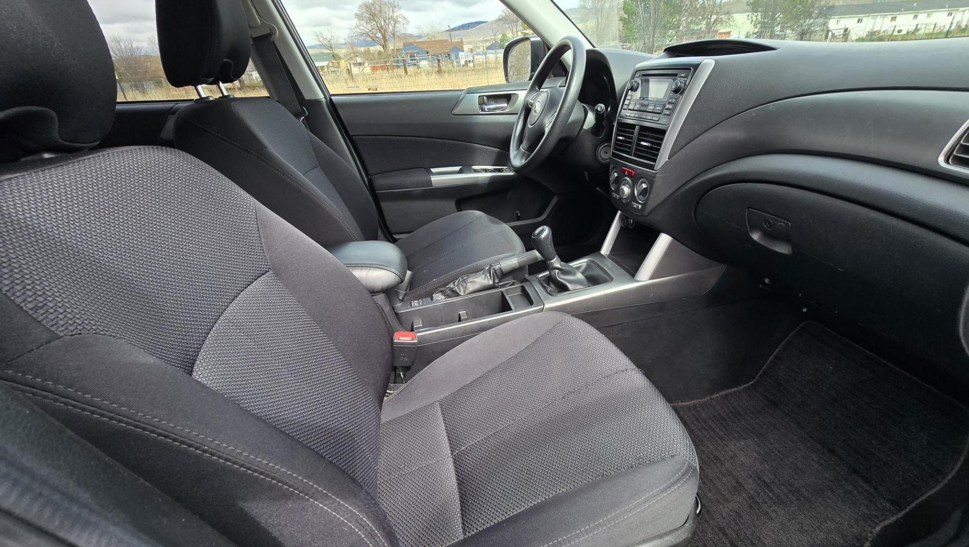 2011 Blue Subaru Forester 2.5X Premium (JF2SHBDC6BG) with an 2.5L H4 SOHC 16V engine, 5-Speed Manual transmission, located at 450 N Russell, Missoula, MT, 59801, (406) 543-6600, 46.874496, -114.017433 - All Wheel Drive. 2.5L H4 Engine. 5 Speed Manual Transmission. Air. Cruise. Tilt. Power Drivers Seat. Power Sun Roof. Heated Seats. Timing Chain, not a Timing Belt. Clean Title and Carfax. - Photo#10