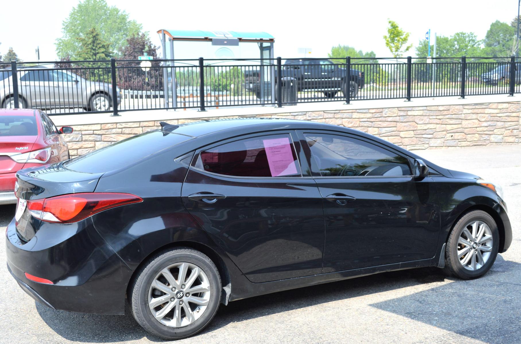 2016 Black Hyundai Elantra Limited (5NPDH4AE9GH) with an 1.8L L4 DOHC 16V engine, 6-Speed Automatic transmission, located at 450 N Russell, Missoula, MT, 59801, (406) 543-6600, 46.874496, -114.017433 - Great Running Sedan. Automatic Transmission. Air. Cruise. Tilt. Backup Camera. Bluetooth. Power Windows and Locks. - Photo #4