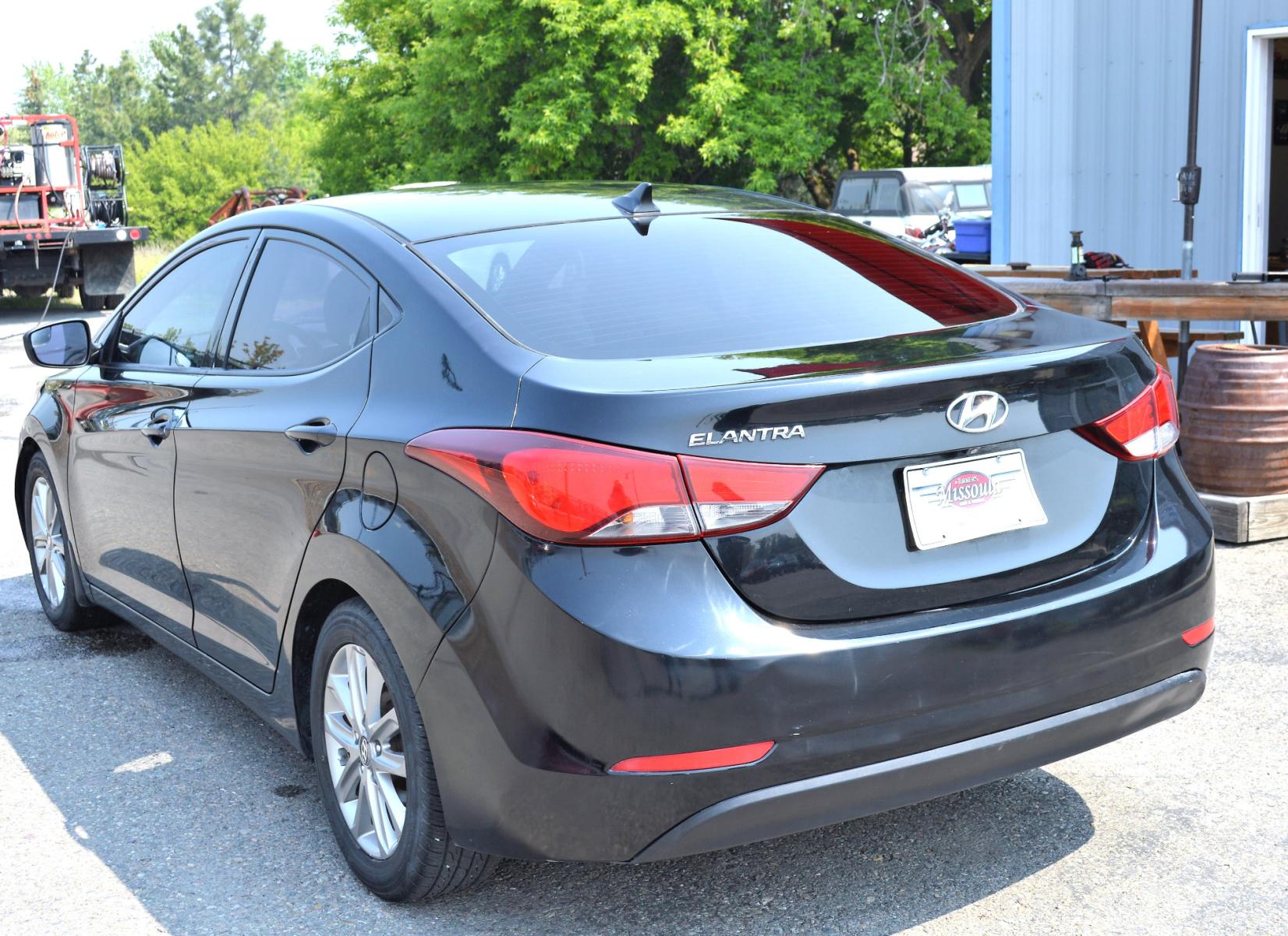 2016 Black Hyundai Elantra Limited (5NPDH4AE9GH) with an 1.8L L4 DOHC 16V engine, 6-Speed Automatic transmission, located at 450 N Russell, Missoula, MT, 59801, (406) 543-6600, 46.874496, -114.017433 - Great Running Sedan. Automatic Transmission. Air. Cruise. Tilt. Backup Camera. Bluetooth. Power Windows and Locks. - Photo #7