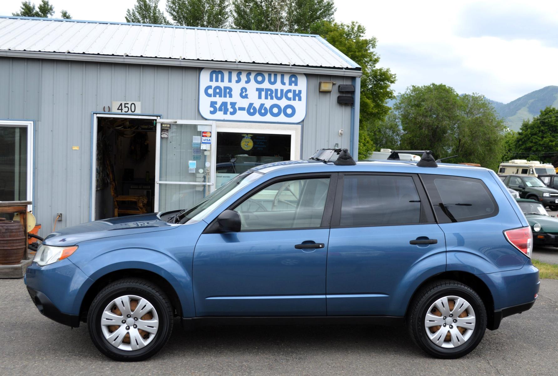 2009 Blue Subaru Forester 2.5X (JF2SH61629H) with an 2.5L H4 SOHC 16V engine, 4-Speed Automatic Overdrive transmission, located at 450 N Russell, Missoula, MT, 59801, (406) 543-6600, 46.874496, -114.017433 - Nice Suby. New Timing and Head Gasket. Automatic Transmission. Air. Cruise, Tilt. Power Windows and Locks. - Photo #0