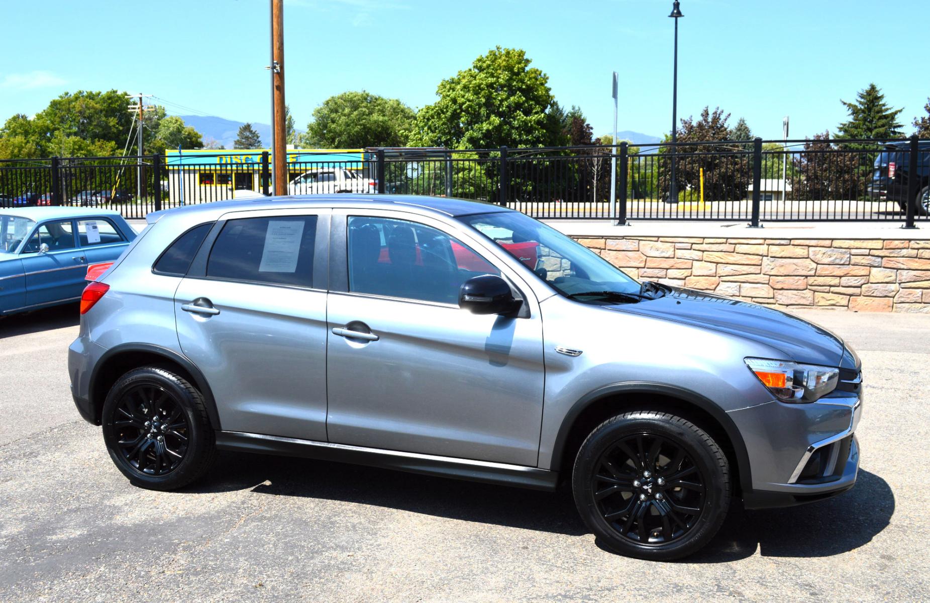 2018 Grey /Black Mitsubishi Outlander Sport 2.0 ES CVT (JA4AP3AU2JZ) with an 2.0L L4 DOHC 16V engine, CVT transmission, located at 450 N Russell, Missoula, MT, 59801, (406) 543-6600, 46.874496, -114.017433 - Cute Little SUV. Automatic Transmission. Air. Cruise. Tilt. Heated Seats. Power Windows. Remote Start. Bluetooth. Backup Camera. 2WD - Photo #4