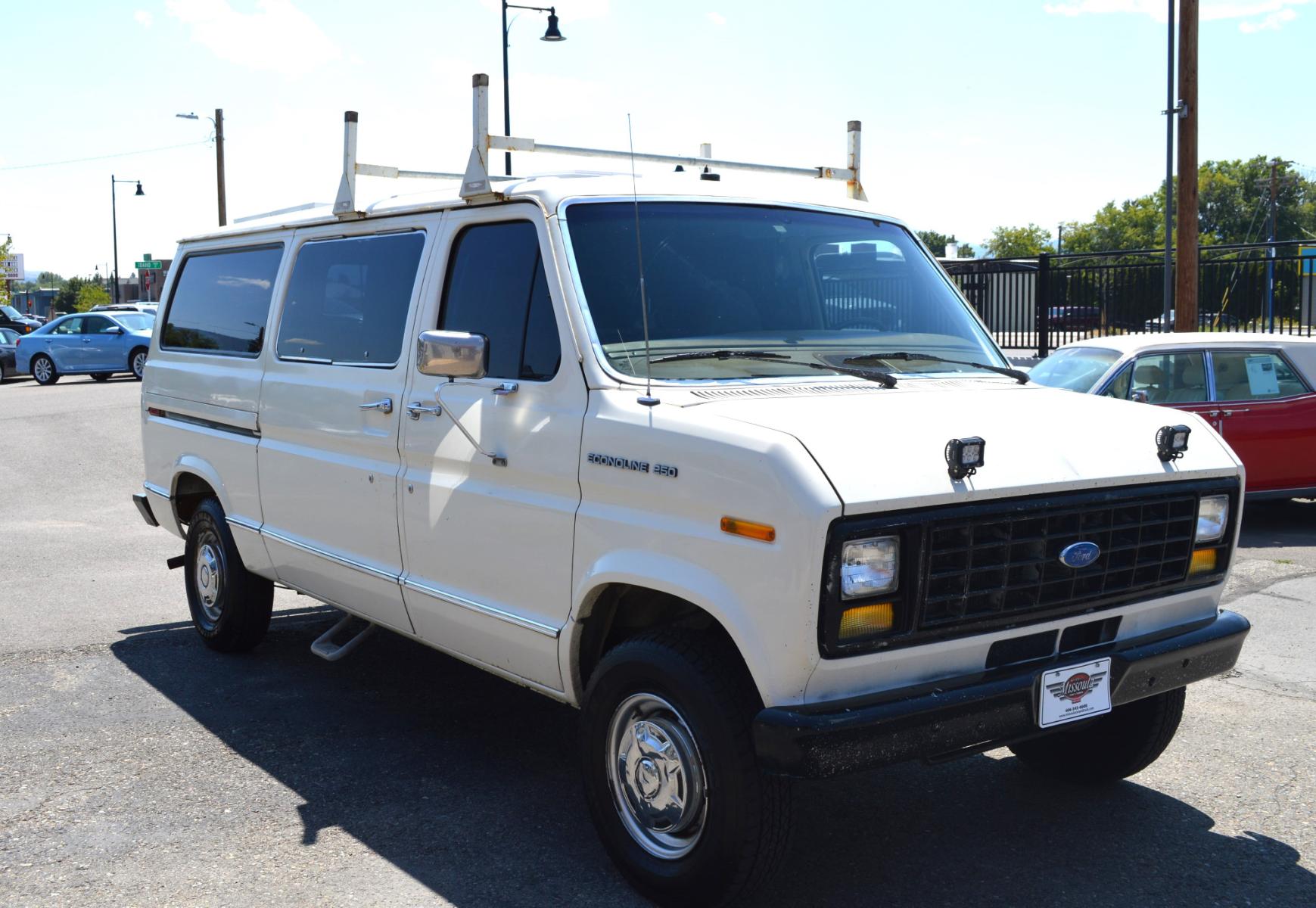 1990 White /Black Ford Econoline E250 (1FTFE24H6LH) with an 5.8L V8 OHV 16V engine, 4-Speed Automatic Overdrive transmission, located at 450 N Russell, Missoula, MT, 59801, (406) 543-6600, 46.874496, -114.017433 - Converted 3/4 Ton Ford Van. Has solar panels on top with a converter for power inside. Had a fold out bed. Comes with a sink that you hook to a 5 gallon water jug. Runs great. This vehicle is more then 20 years old and is not eligible for lending through our finance companies. - Photo #3