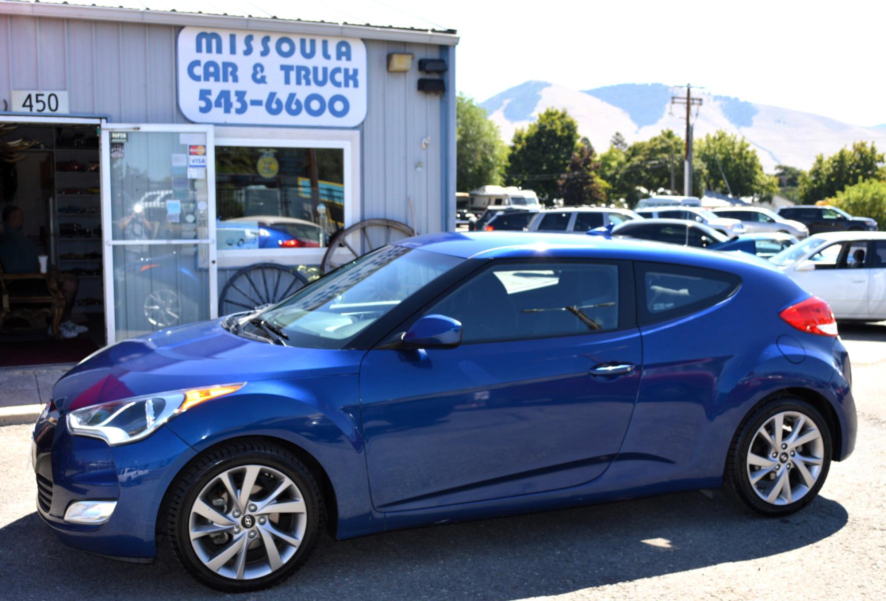 2017 Blue /Black Hyundai Veloster Base 6MT (KMHTC6AD2HU) with an 1.6L L4 DOHC 16V engine, 6M Automatic transmission, located at 450 N Russell, Missoula, MT, 59801, (406) 543-6600, 46.874496, -114.017433 - Cute Little Coupe. 3 Doors. Automatic Transmission. Air. Cruise. Tilt. Power Windows and Locks. Bluetooth. Backup Camera. - Photo #0
