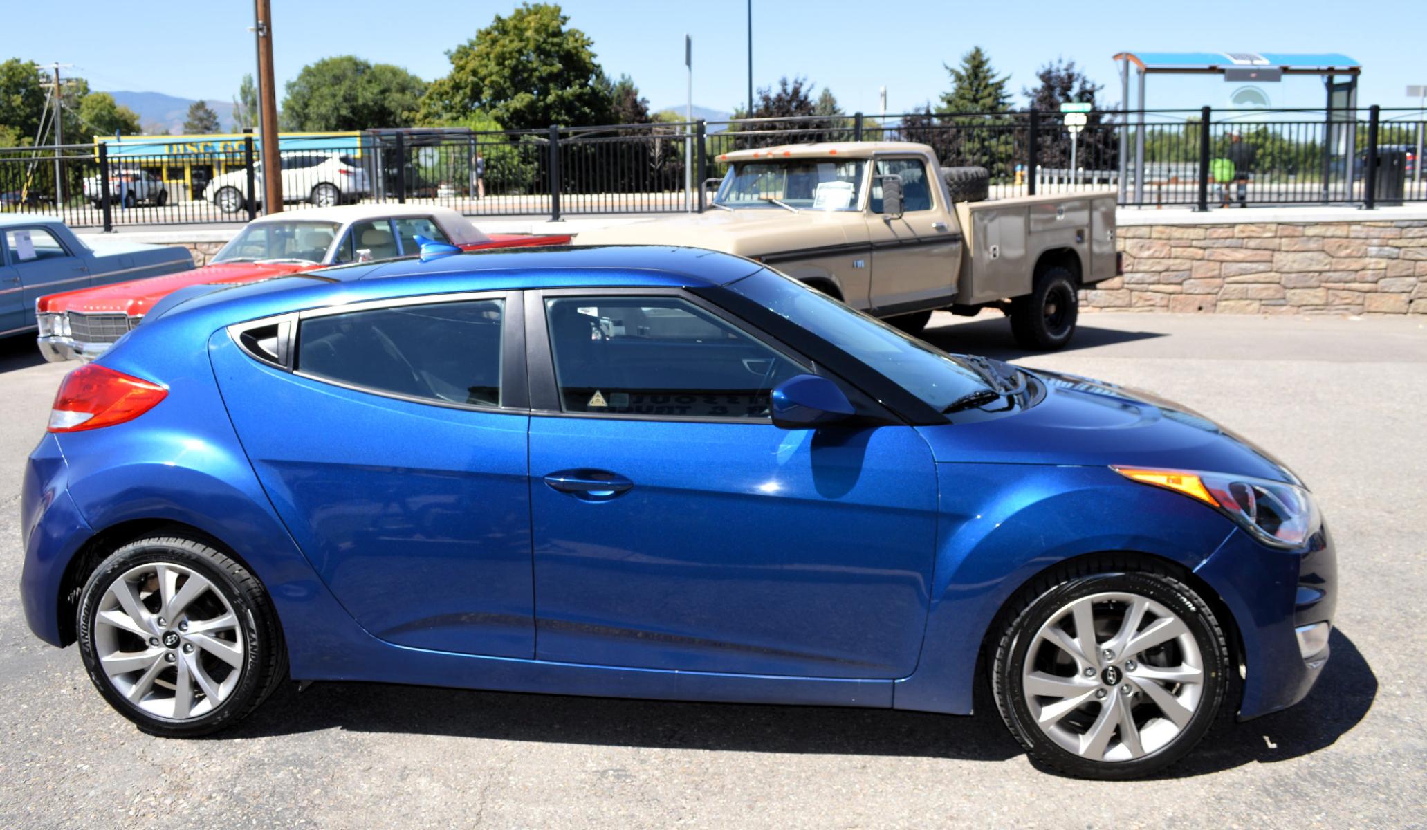 2017 Blue /Black Hyundai Veloster Base 6MT (KMHTC6AD2HU) with an 1.6L L4 DOHC 16V engine, 6M Automatic transmission, located at 450 N Russell, Missoula, MT, 59801, (406) 543-6600, 46.874496, -114.017433 - Cute Little Coupe. 3 Doors. Automatic Transmission. Air. Cruise. Tilt. Power Windows and Locks. Bluetooth. Backup Camera. - Photo #3