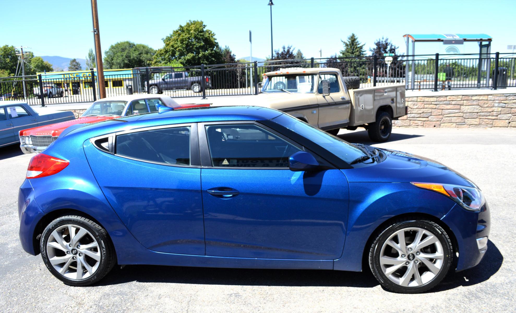 2017 Blue /Black Hyundai Veloster Base 6MT (KMHTC6AD2HU) with an 1.6L L4 DOHC 16V engine, 6M Automatic transmission, located at 450 N Russell, Missoula, MT, 59801, (406) 543-6600, 46.874496, -114.017433 - Cute Little Coupe. 3 Doors. Automatic Transmission. Air. Cruise. Tilt. Power Windows and Locks. Bluetooth. Backup Camera. - Photo #4