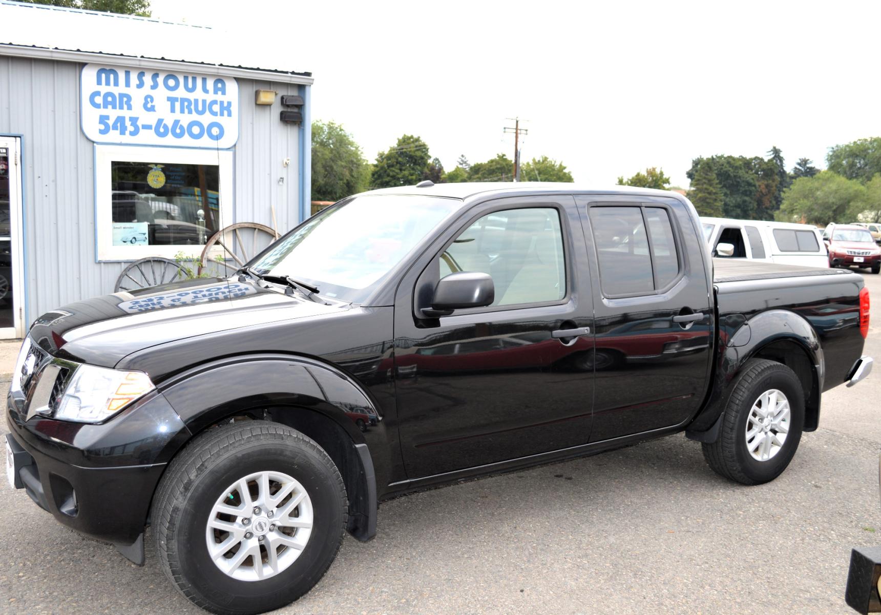 2017 Black /Tan Nissan Frontier SL Crew Cab 5AT 2WD (1N6AD0ER4HN) with an 4.0L V6 DOHC 24V engine, 5A transmission, located at 450 N Russell, Missoula, MT, 59801, (406) 543-6600, 46.874496, -114.017433 - Automatic Transmission, Heated Seats. Air. Cruise. Tilt. Power Windows and Locks. AM FM XM CD Player. Bluetooth. Backup Camera. Bed Liner. Towing. Tonneau Cover. - Photo #0