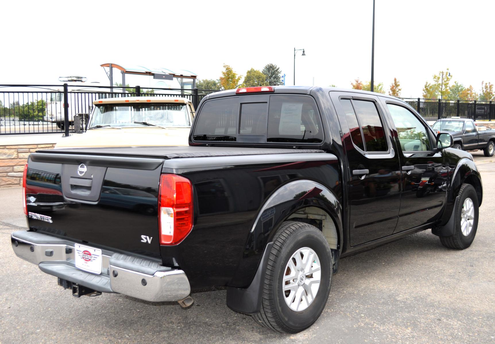 2017 Black /Tan Nissan Frontier SL Crew Cab 5AT 2WD (1N6AD0ER4HN) with an 4.0L V6 DOHC 24V engine, 5A transmission, located at 450 N Russell, Missoula, MT, 59801, (406) 543-6600, 46.874496, -114.017433 - Automatic Transmission, Heated Seats. Air. Cruise. Tilt. Power Windows and Locks. AM FM XM CD Player. Bluetooth. Backup Camera. Bed Liner. Towing. Tonneau Cover. - Photo #7